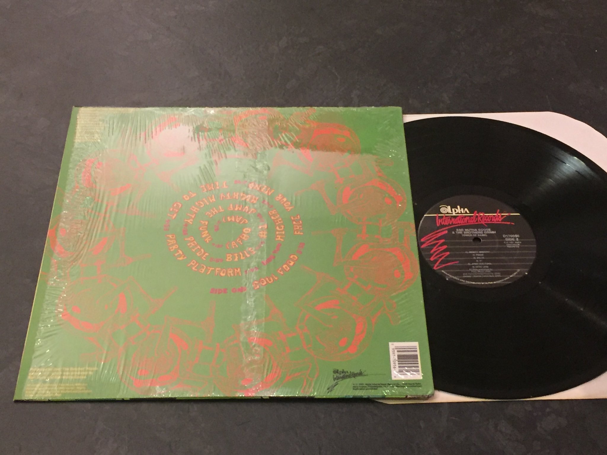 Omslagsbild för skivan Bad Mutha Goose And The Brothers Grimm Tower of Babel LP -91 US ALPHA INT.