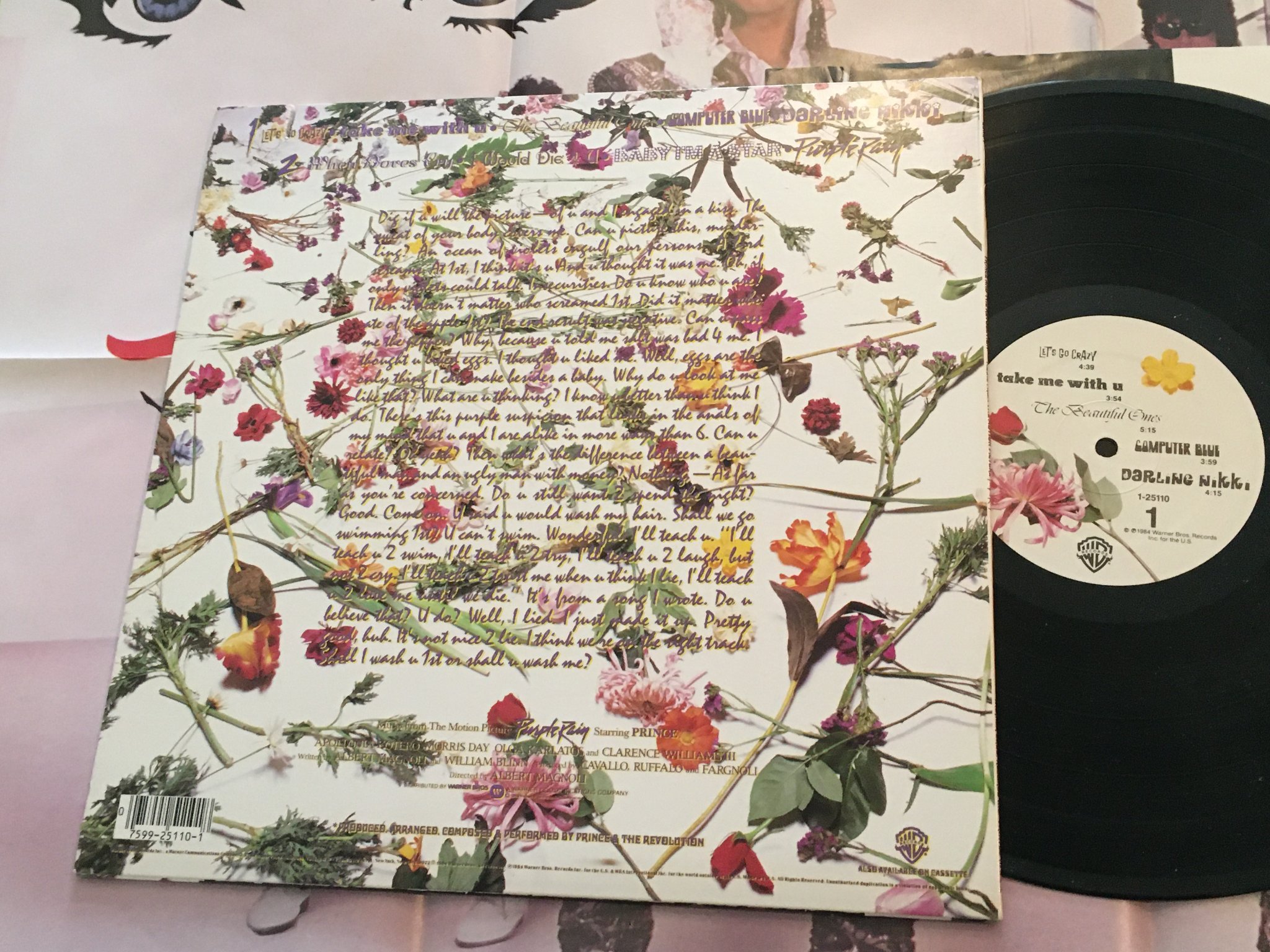 Omslagsbild för skivan PRINCE purple rain LP -84 WARNER BROS 1-25110 with POSTER 