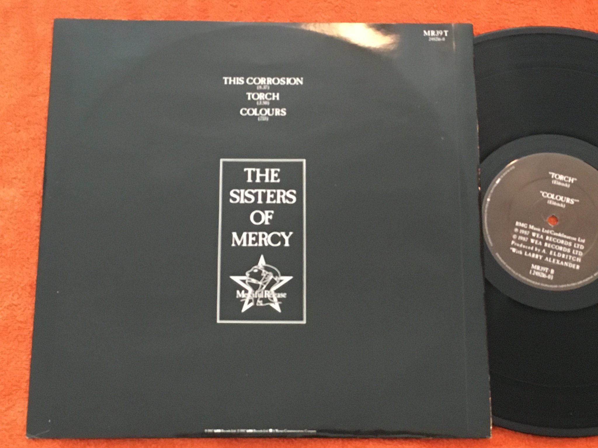 Omslagsbild för skivan SISTERS OF MERCY corrosion 12"single -87 MERCIFUL RELEASE MR 39T