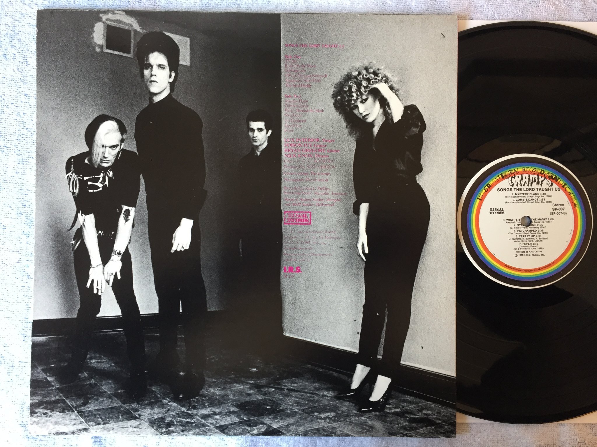 Omslagsbild för skivan THE CRAMPS songs the lord taught us LP -80 US ILLEGAL SP-007
