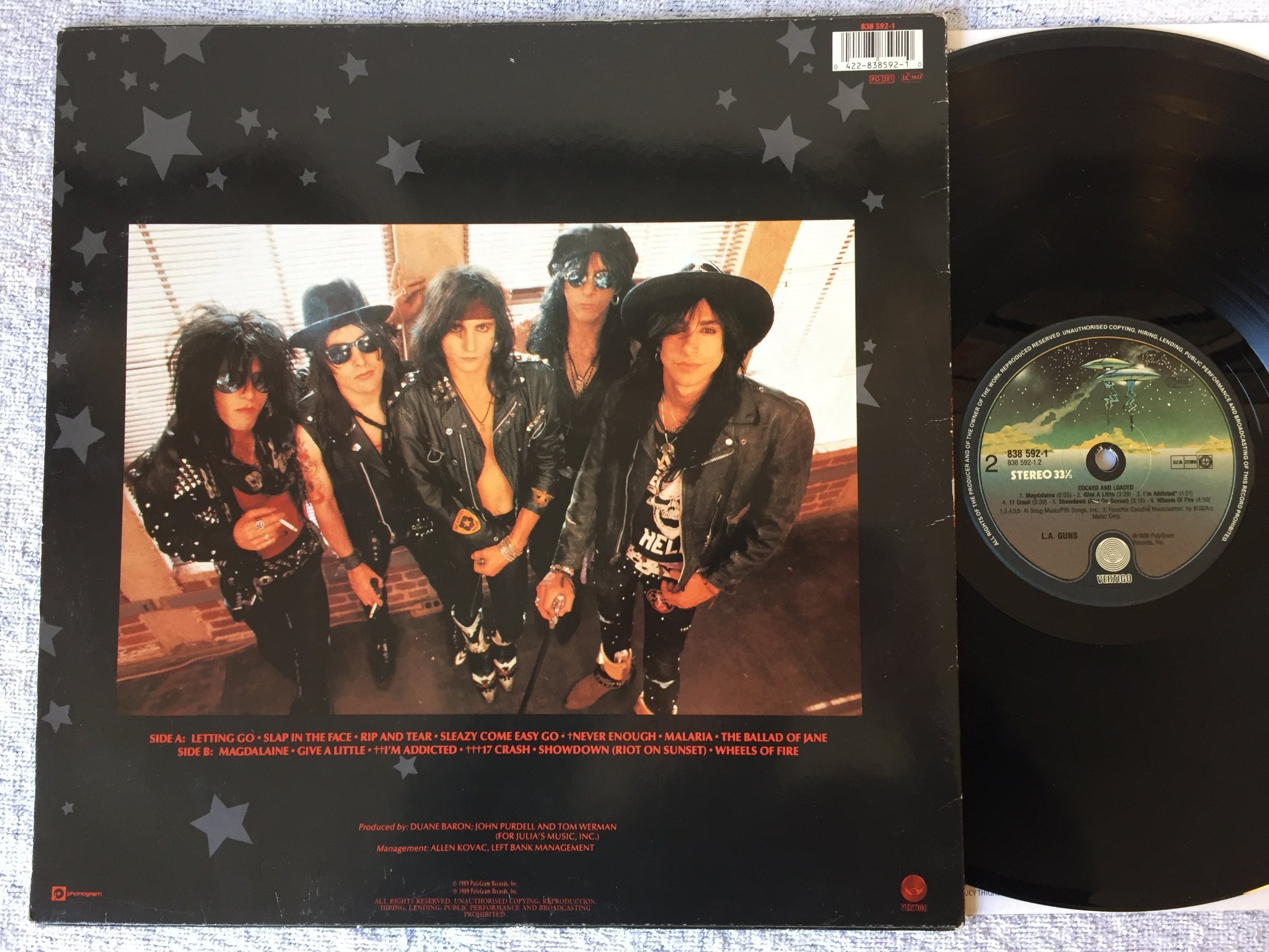 Omslagsbild för skivan L.A. GUNS cocked and loaded LP -89 Ger VERTIGO 838592-1