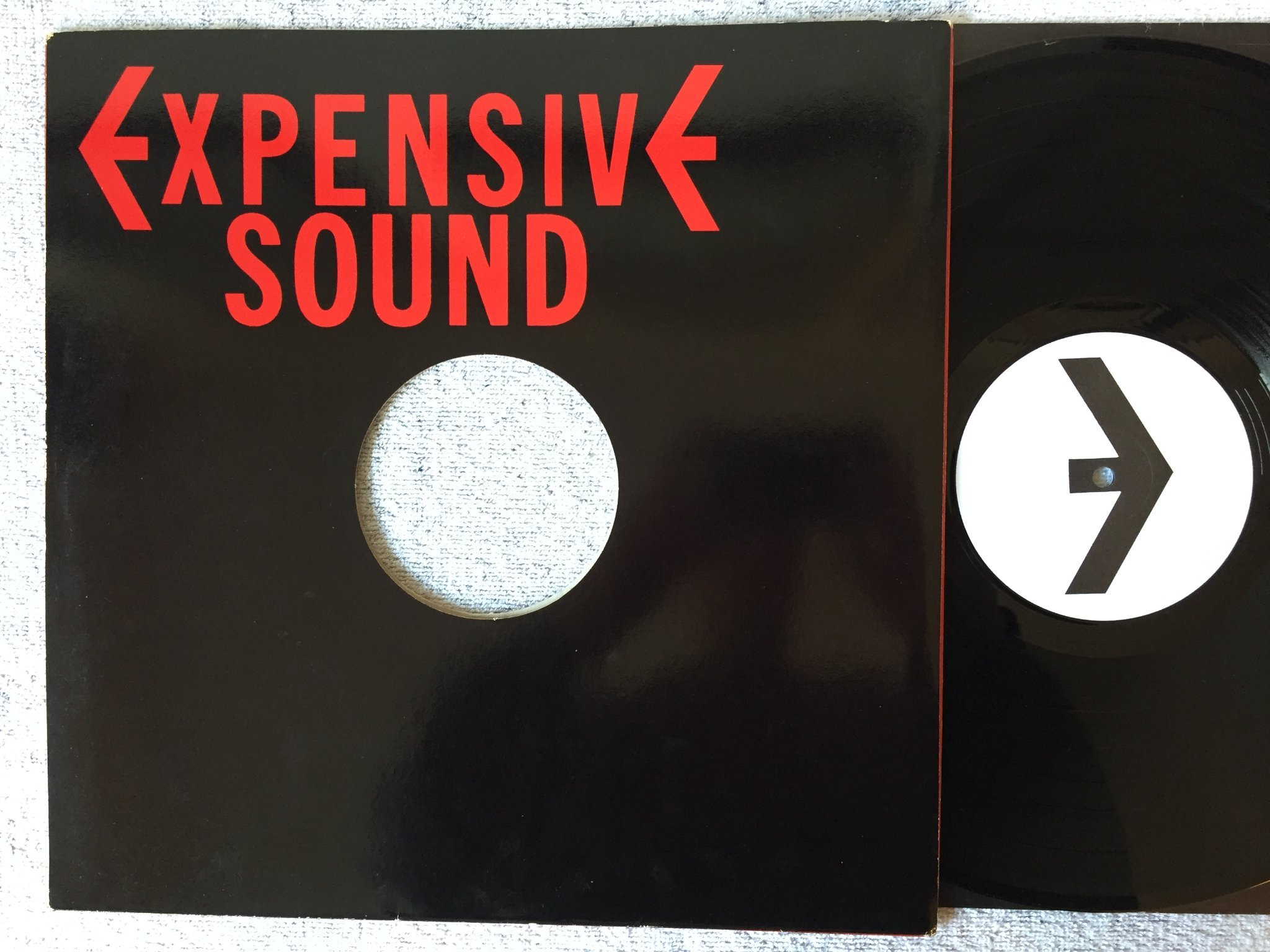 Omslagsbild för skivan EMPIRE expensive sound LP -81 UK DINOSAUR DISCS D/E 001 power pop / punk