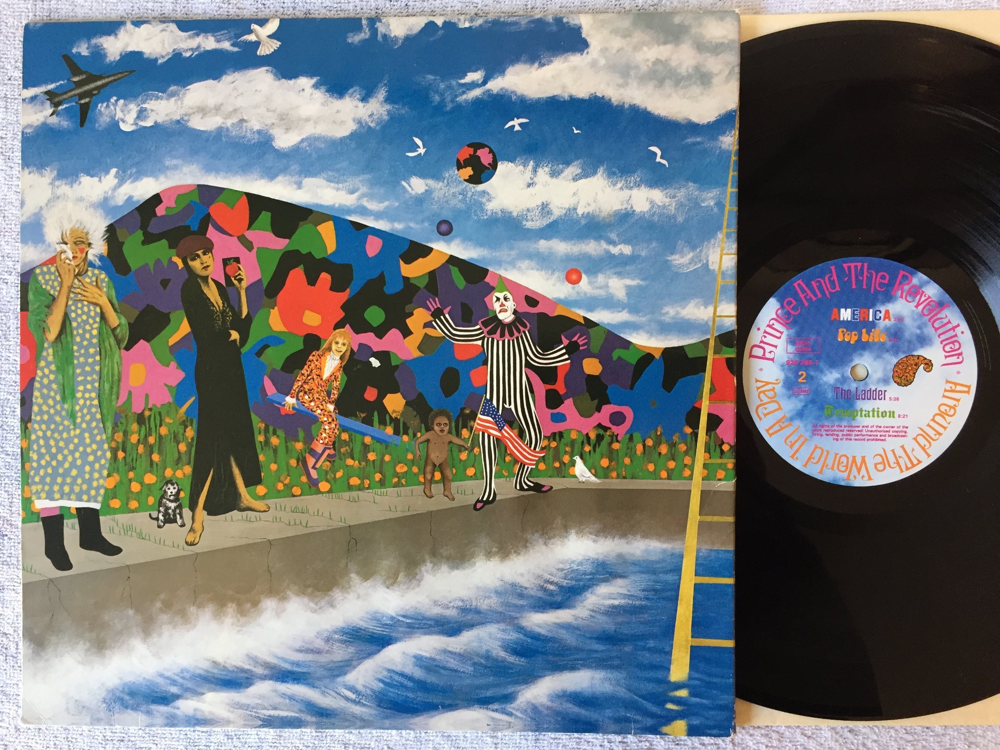 Omslagsbild för skivan PRINCE AND THE REVOLUTION around the world in a day LP -85 paisley park  