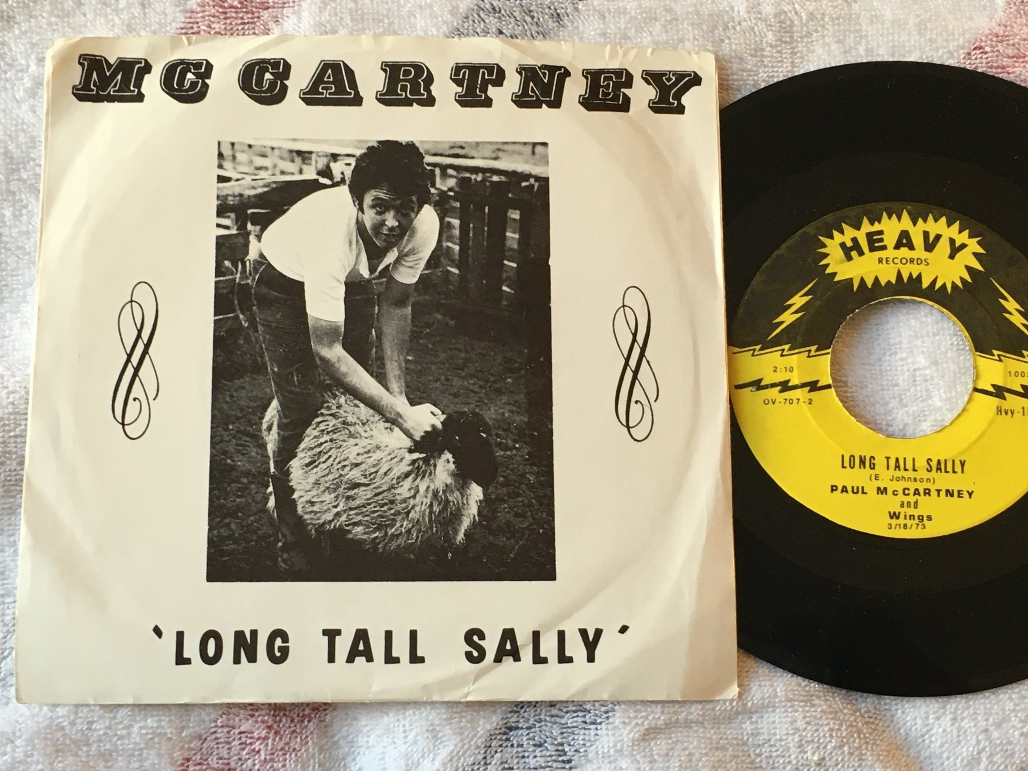 Omslagsbild för skivan John Lennon hound dog 7"single -73 US HEAVY HVY-101 