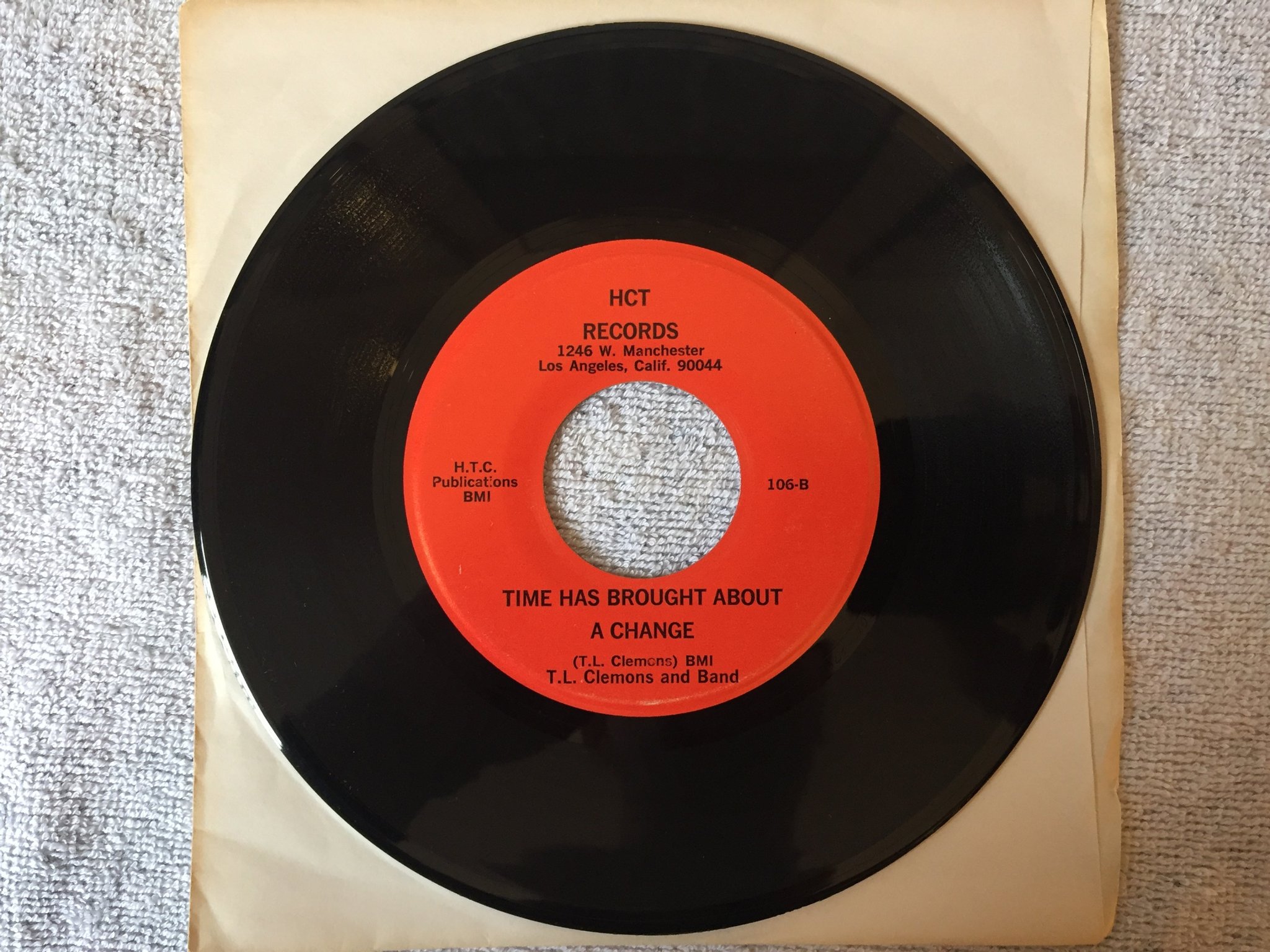 Omslagsbild för skivan T.L. CLEMENS AND BAND story about a woman 7"single US HCT 106