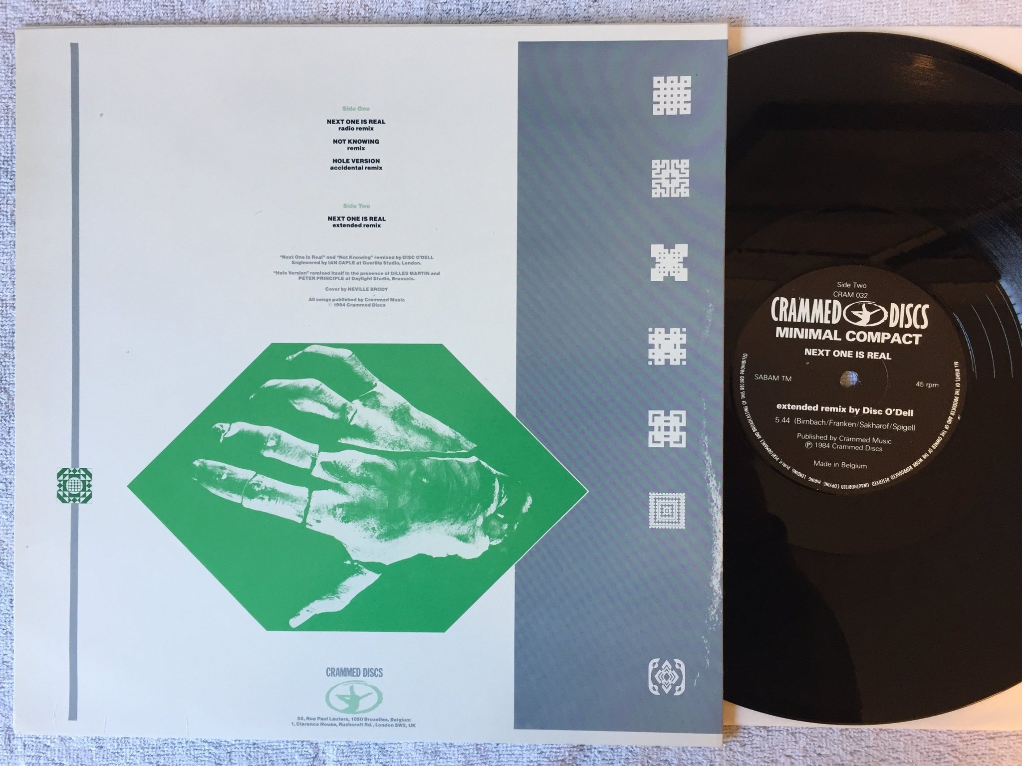 Omslagsbild för skivan MINIMAL COMPACT Next One Is Real 12"single BELGIUM CRAMMED DISCS CRAM 032