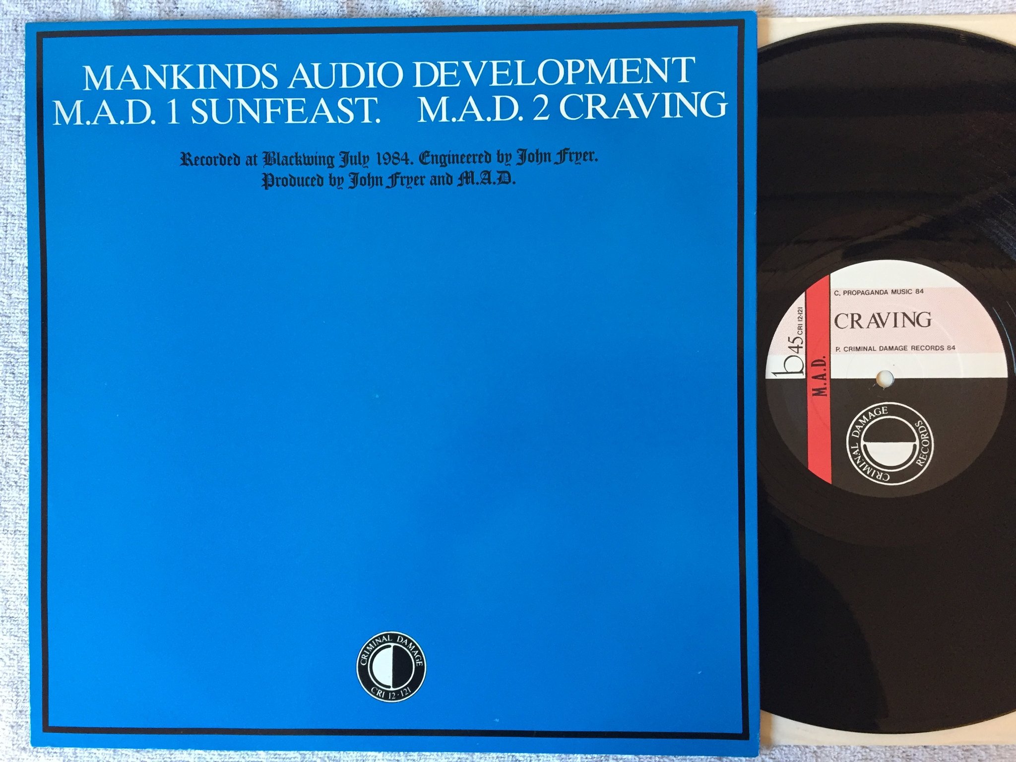 Omslagsbild för skivan M.A.D. Sunfeast 12"single -84 UK criminal damage cri 12-121