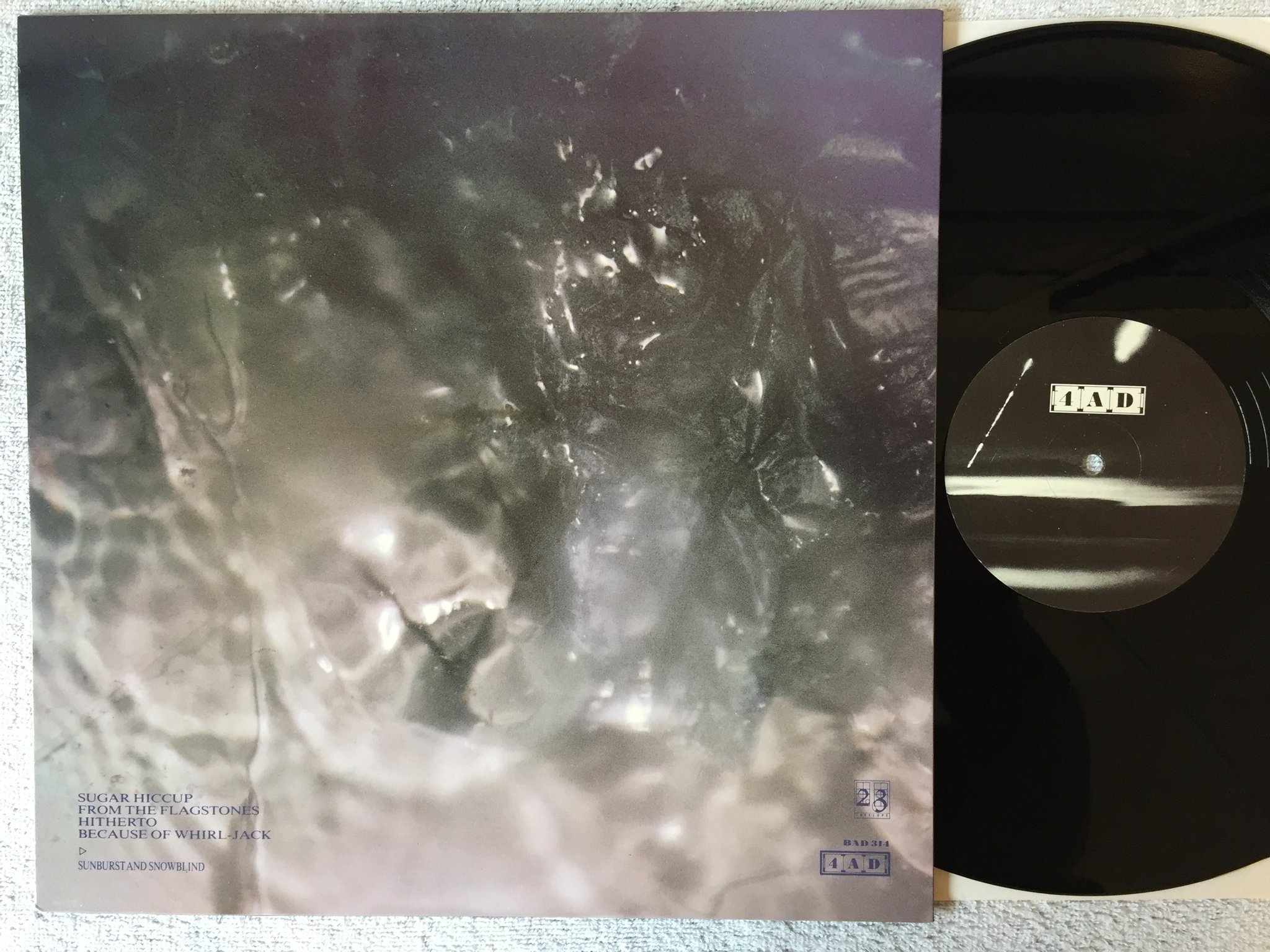 Omslagsbild för skivan COCTEAU TWINS Sunburst And Snowblind 12"single -83 UK 4AD BAD 314