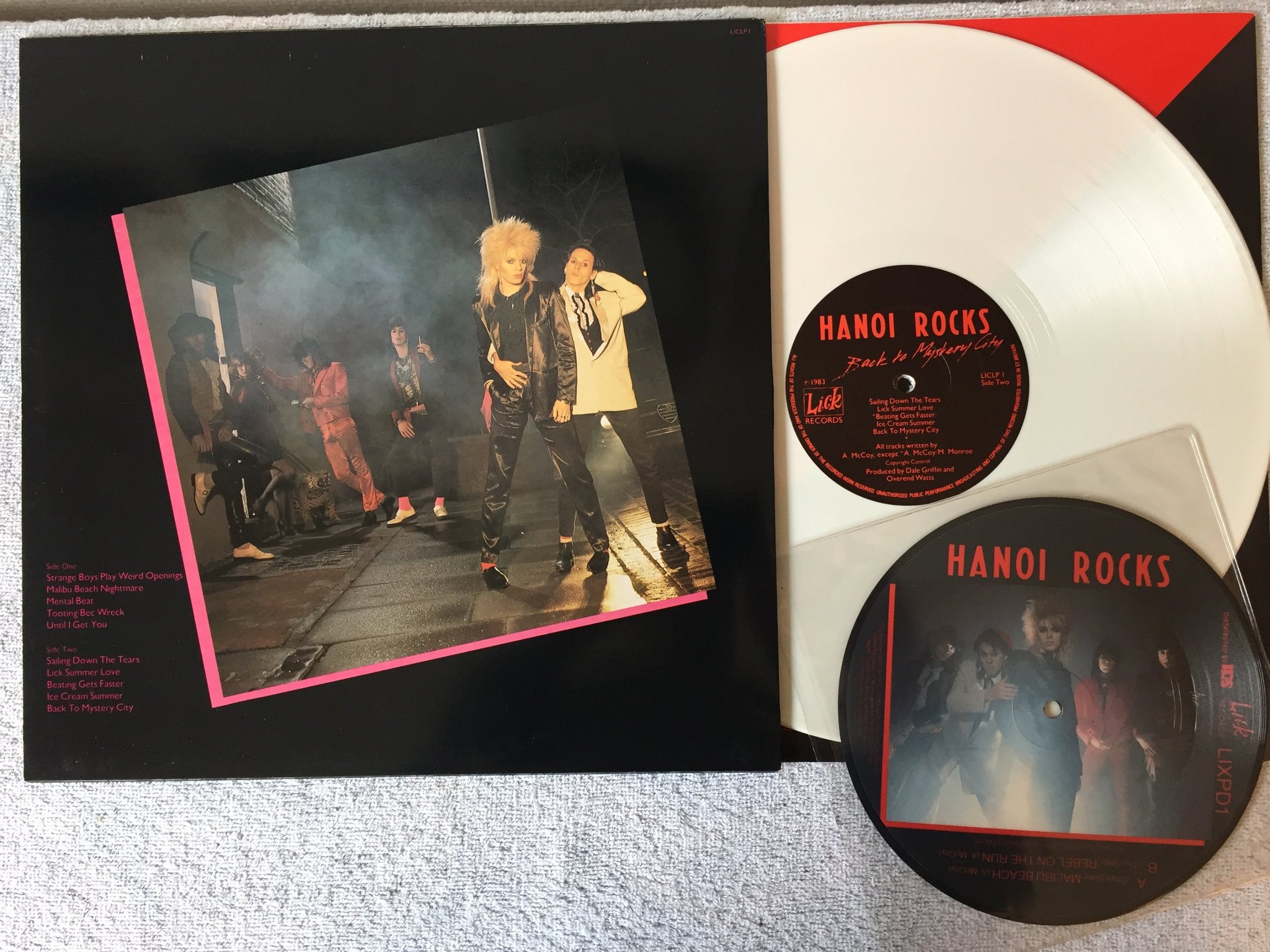 Omslagsbild för skivan HANOI ROCKS Back To Mystery City LP + 7"picture disc LICK LICLP1 white vinyl