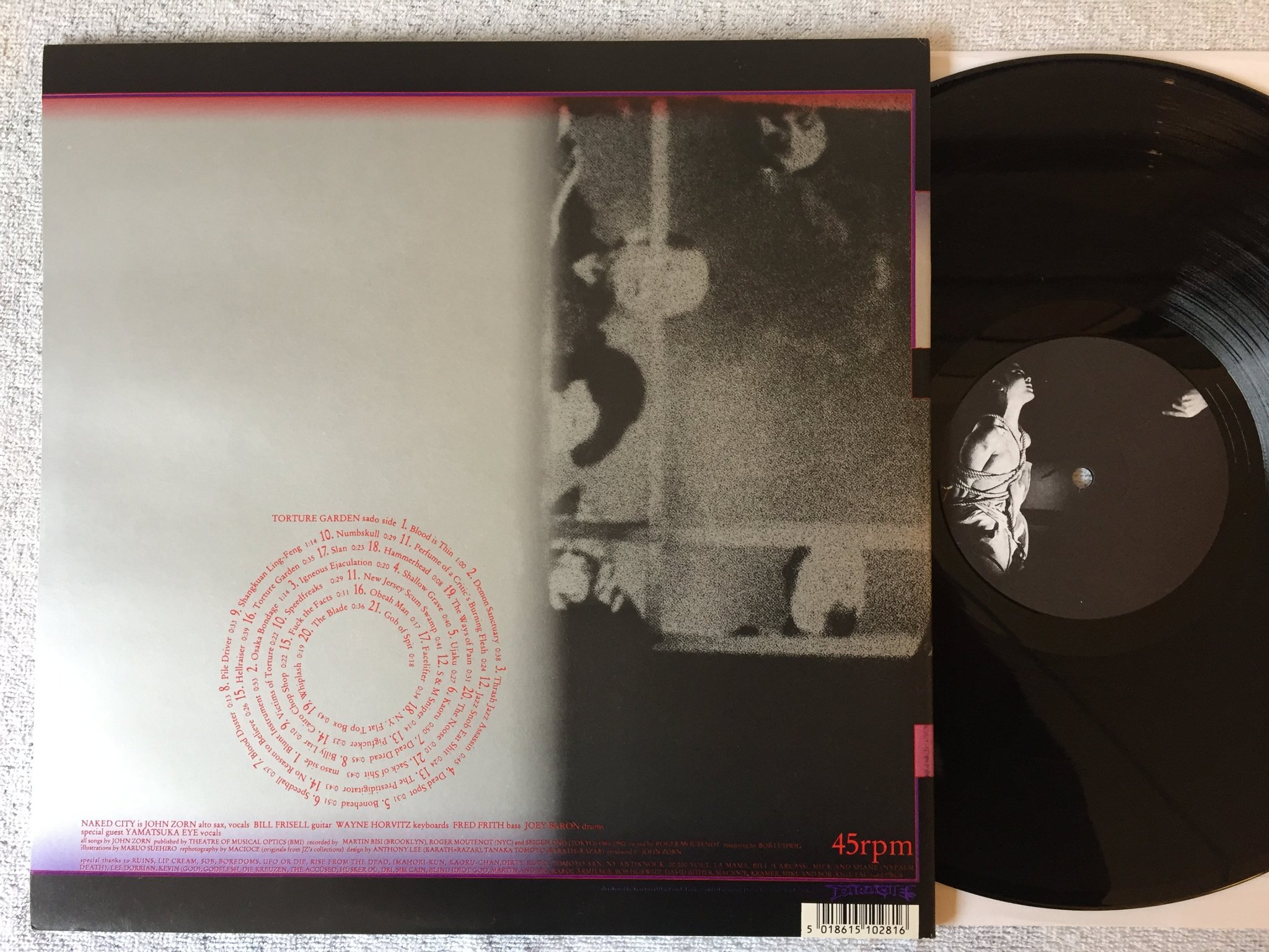 Omslagsbild för skivan NAKED CITY Torture Garden 12" UK -91 EARACHE MOSH 28 