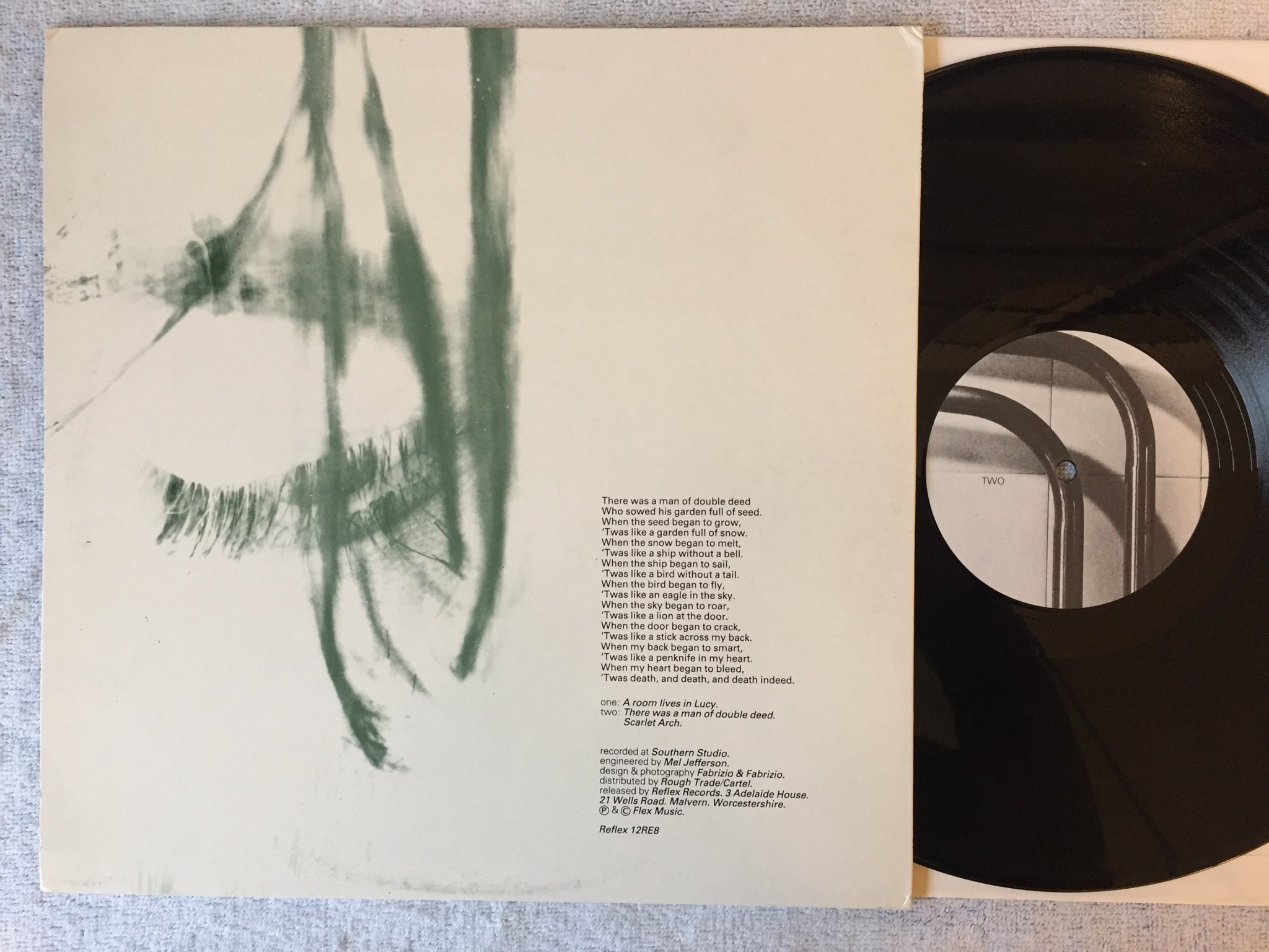 Omslagsbild för skivan AND ALSO THE TREES A Room Lives In Lucy 12"single -85 UK REFLEX 12 RE 8