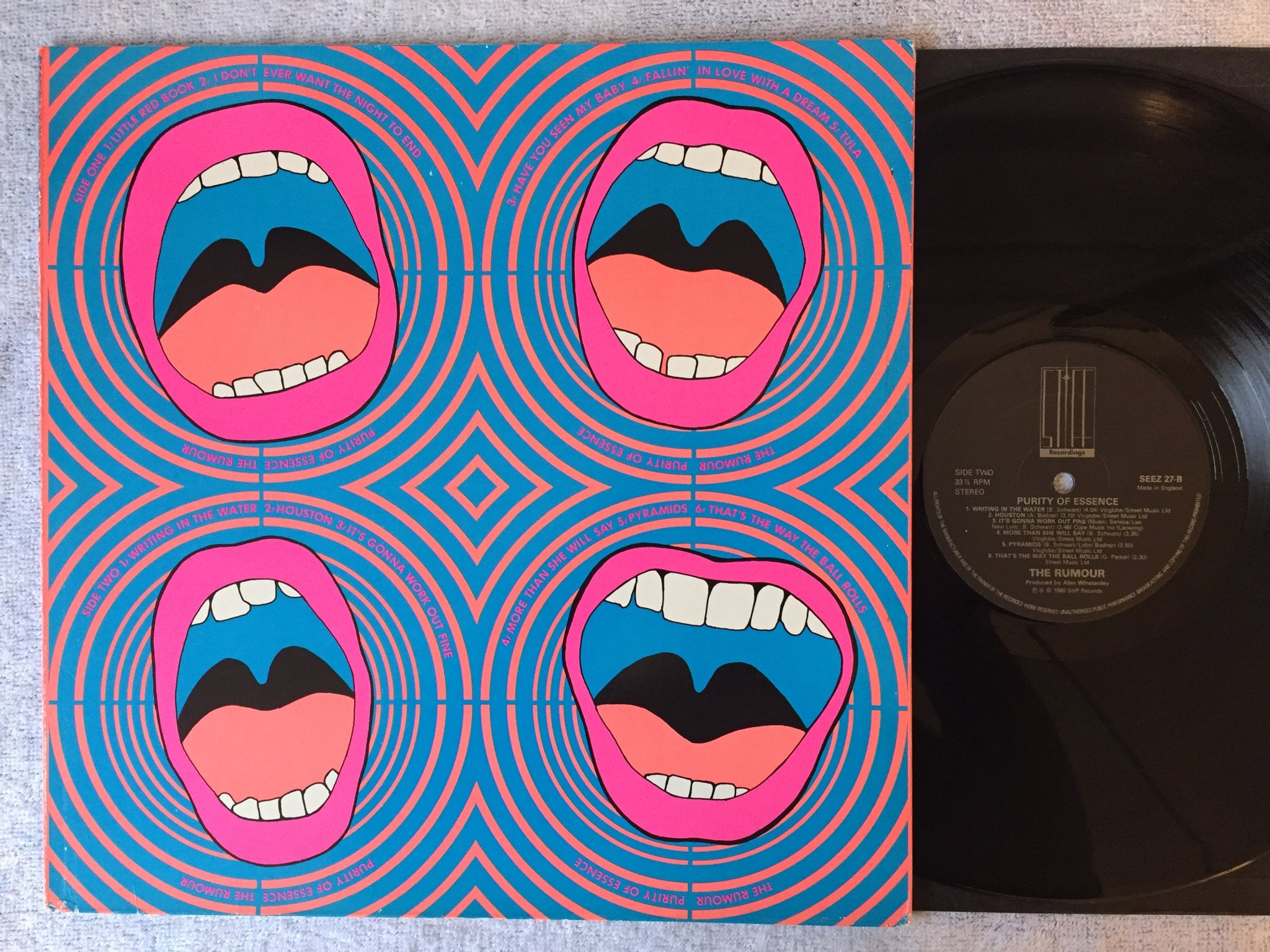 Omslagsbild för skivan THE RUMOUR purity of essence LP -80 UK STIFF SEEZ 27 new wave