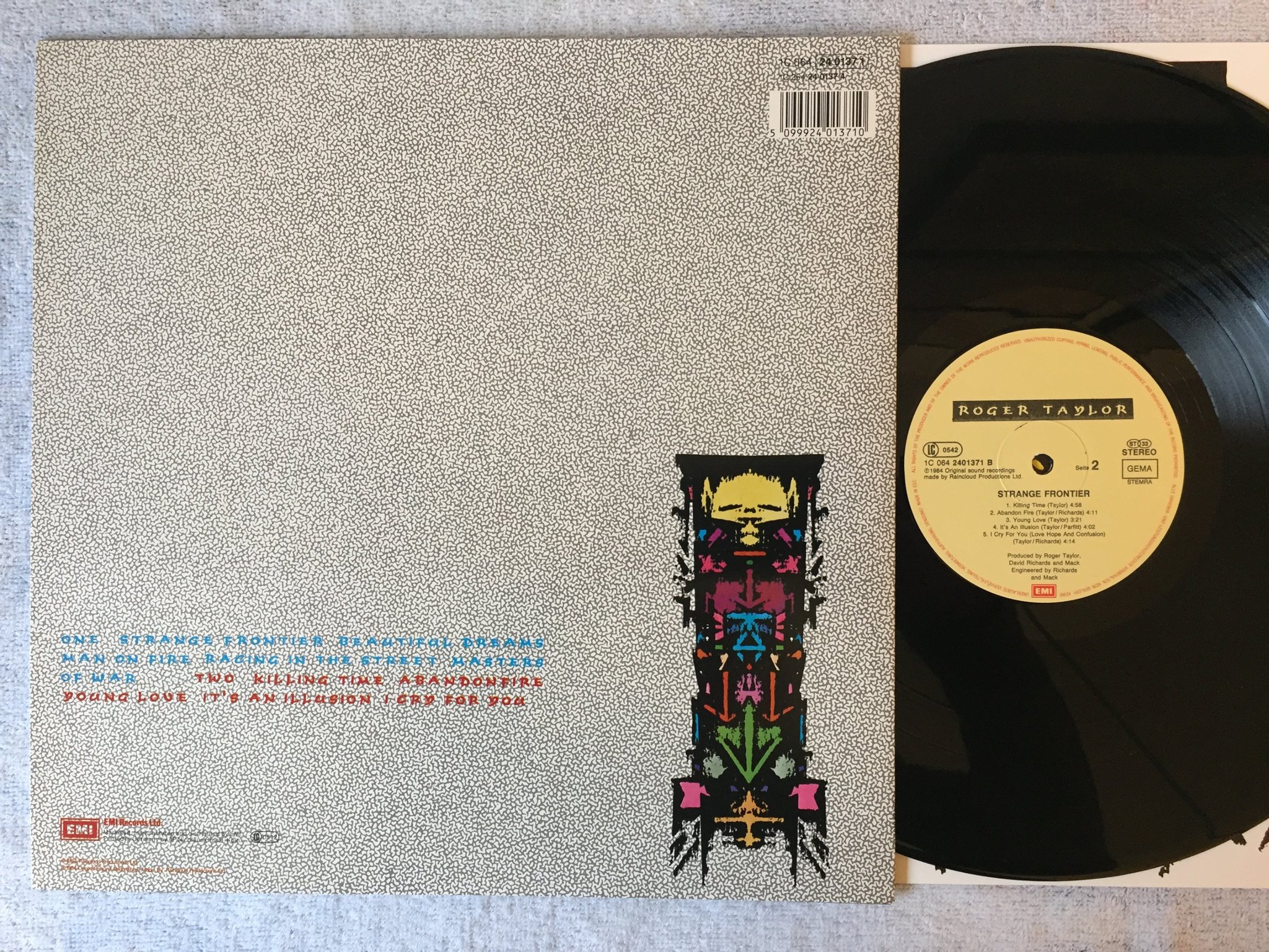 Omslagsbild för skivan ROGER TAYLOR strange frontier LP -84 Ger EMI 1C 064 2401371