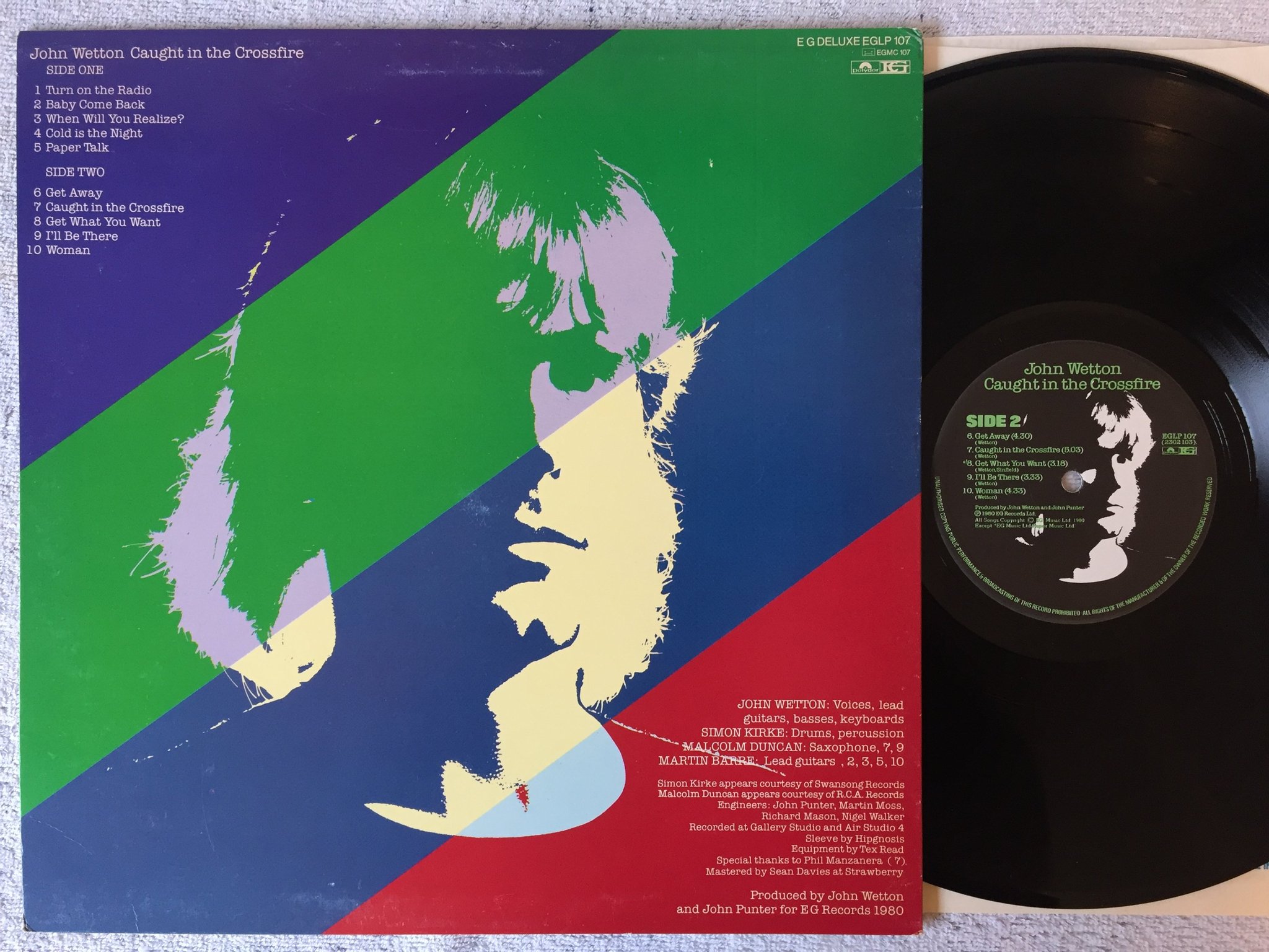 Omslagsbild för skivan JOHN WETTON caught In The Crossfire LP -80 UK EG EGLP107