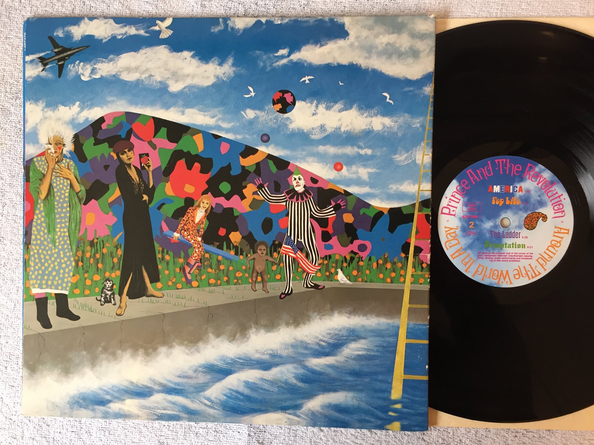 Omslagsbild för skivan PRINCE around the world in a day LP -85 Ger WARNER BROS 925 286-1