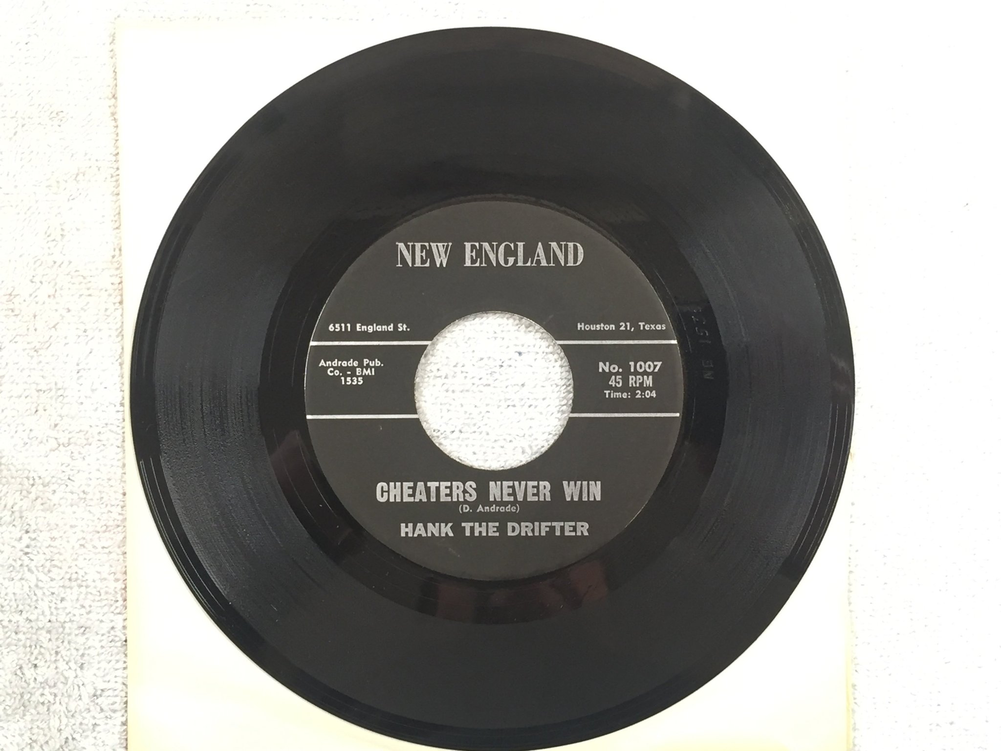 Omslagsbild för skivan HANK THE DRIFTER Cheaters Never Win 7"single -62 US NEW ENGLAND rare country
