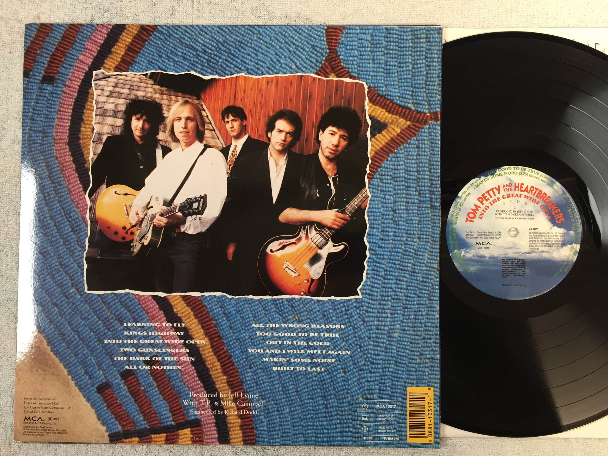 Omslagsbild för skivan TOM PETTY & THE HEARTBREAKERS into the great wide open LP -89 Ger MCA 10317