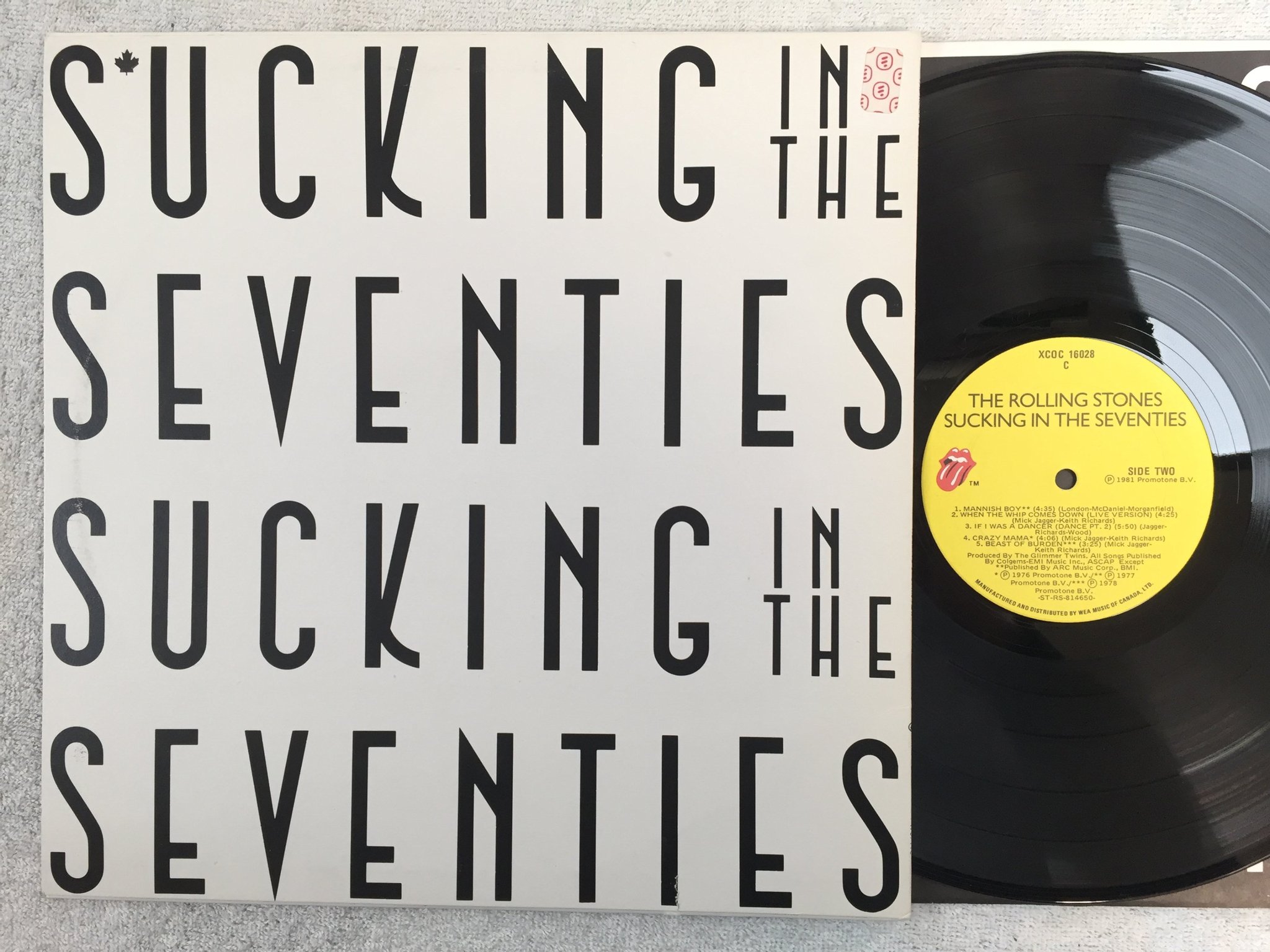 Omslagsbild för skivan ?THE ROLLING STONES sucking in the seventies LP -81 Can XCOC 16028 C