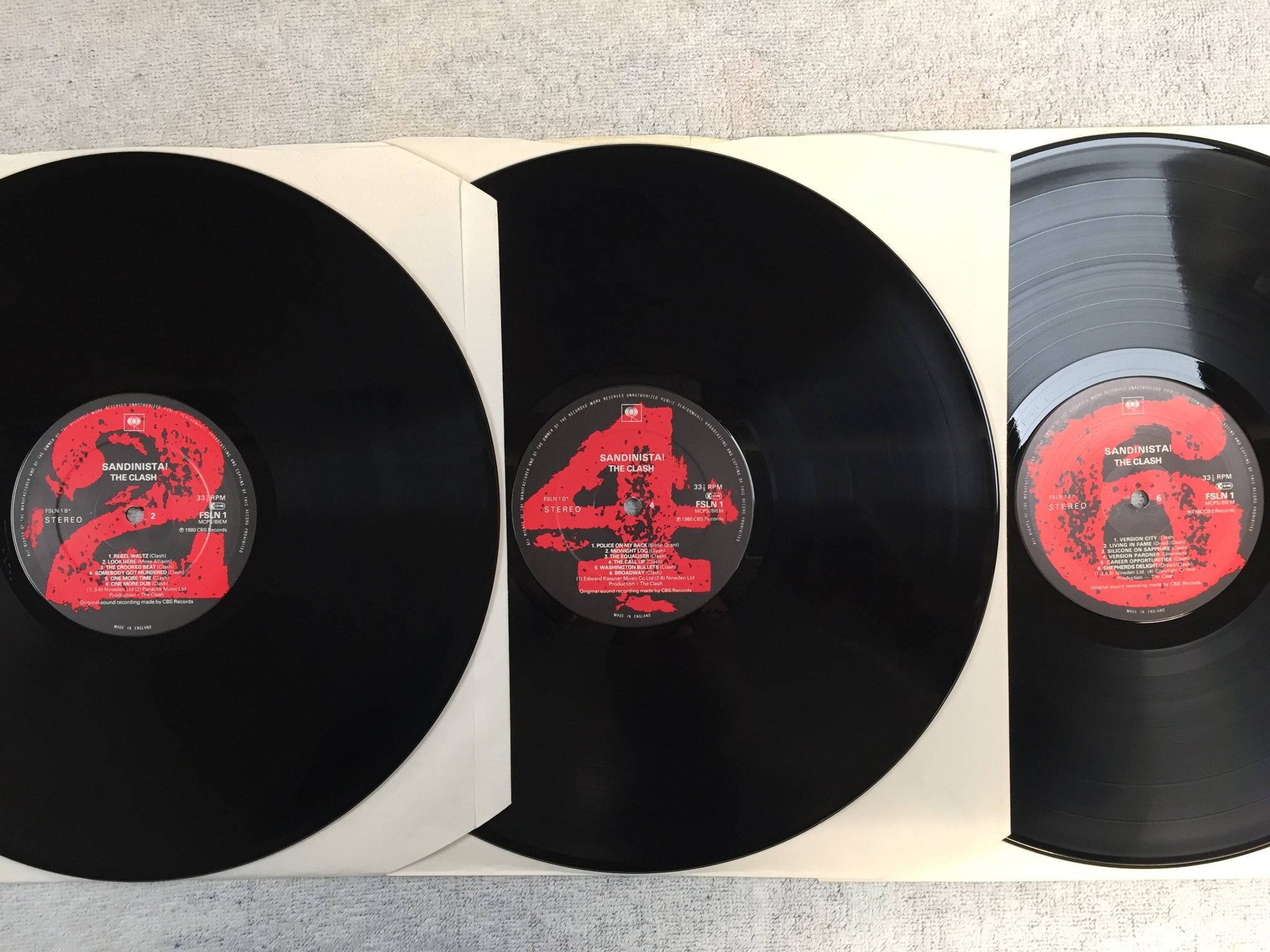 Omslagsbild för skivan THE CLASH sandinista! 3xLP -80 UK CBS FSLN 1 