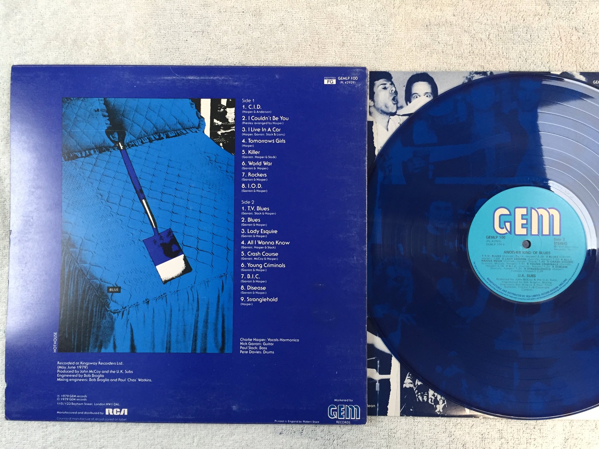 Omslagsbild för skivan UK SUBS Another Kind Of Blues LP -79 UK GEM GEMLP 100 blue vinyl