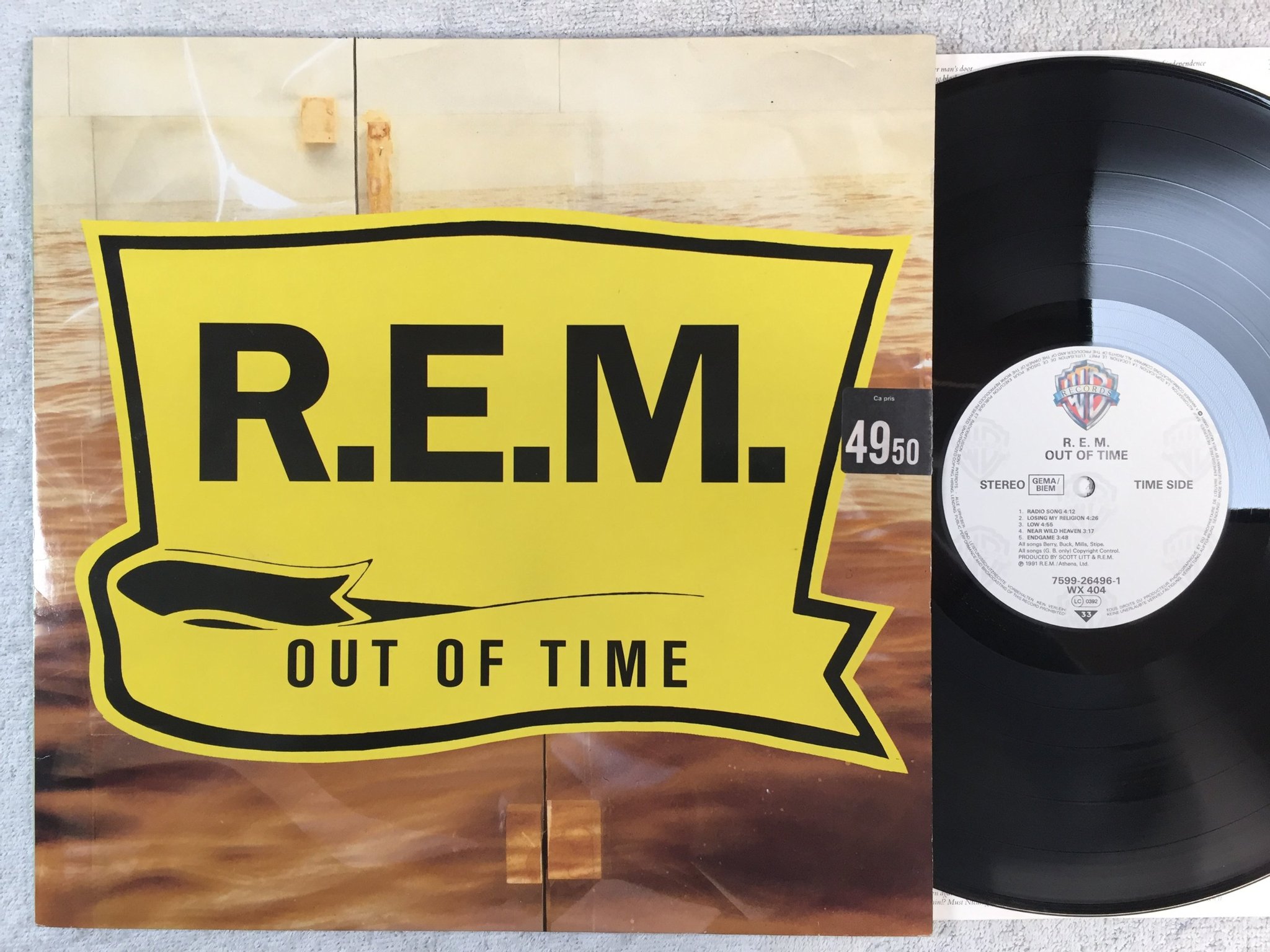 Omslagsbild för skivan R.E.M. out of time LP -91 Ger WARNER BROS 7599-26496-1