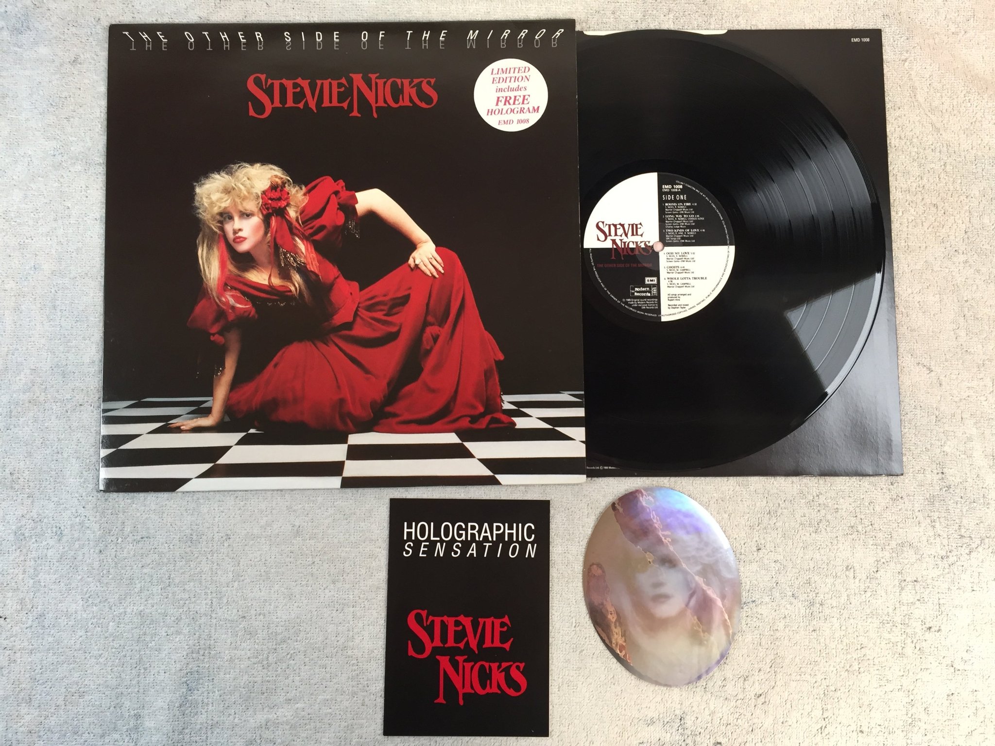 Omslagsbild för skivan STEVIE NICKS The Other Side Of The Mirror LP -89 UK EMI EMD 1008  w/ hologram