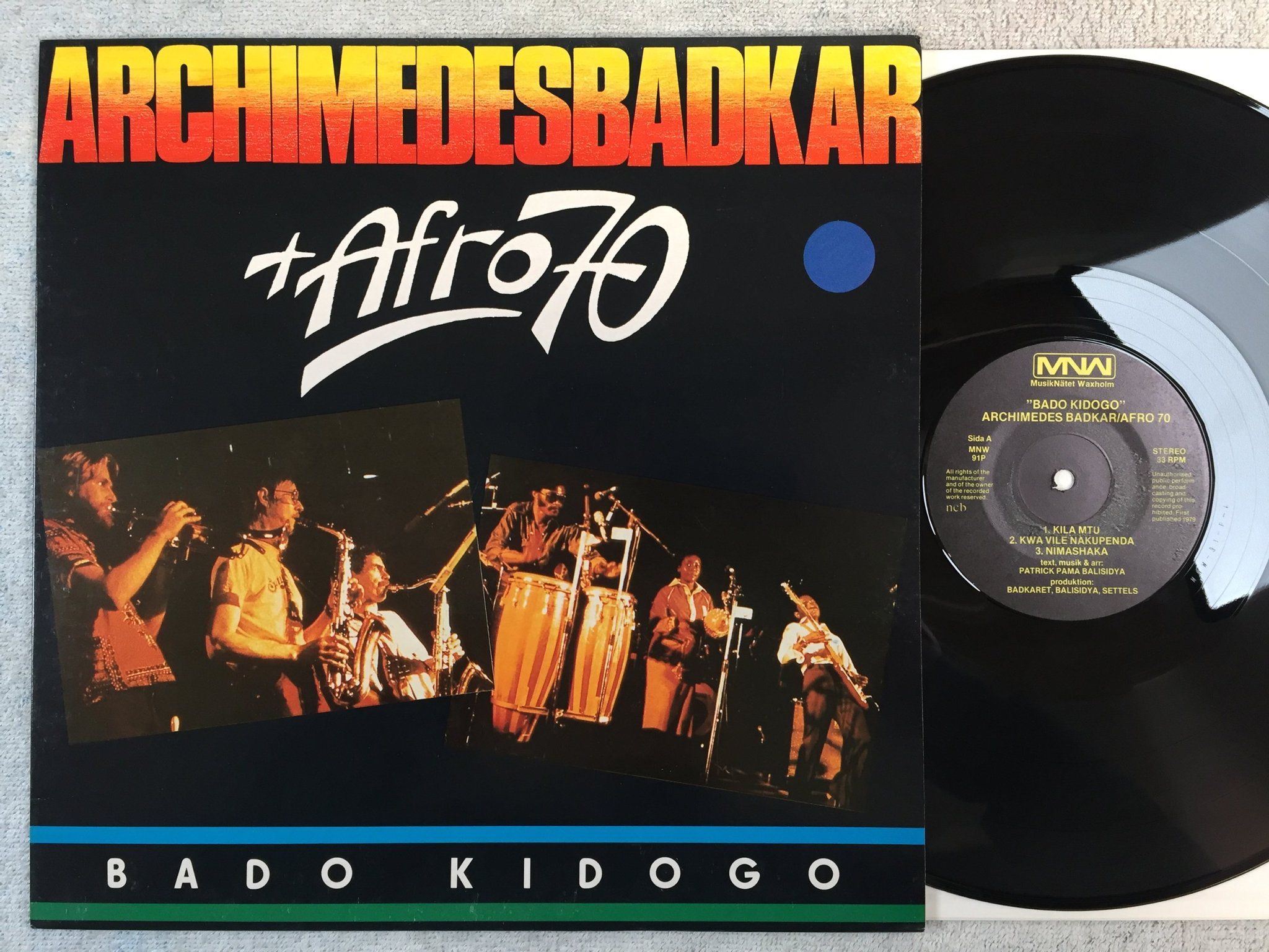 Omslagsbild för skivan ARCHIMEDES BADKAR / AFRO 70 bado kidogo LP -79 Swe MNW 91p  