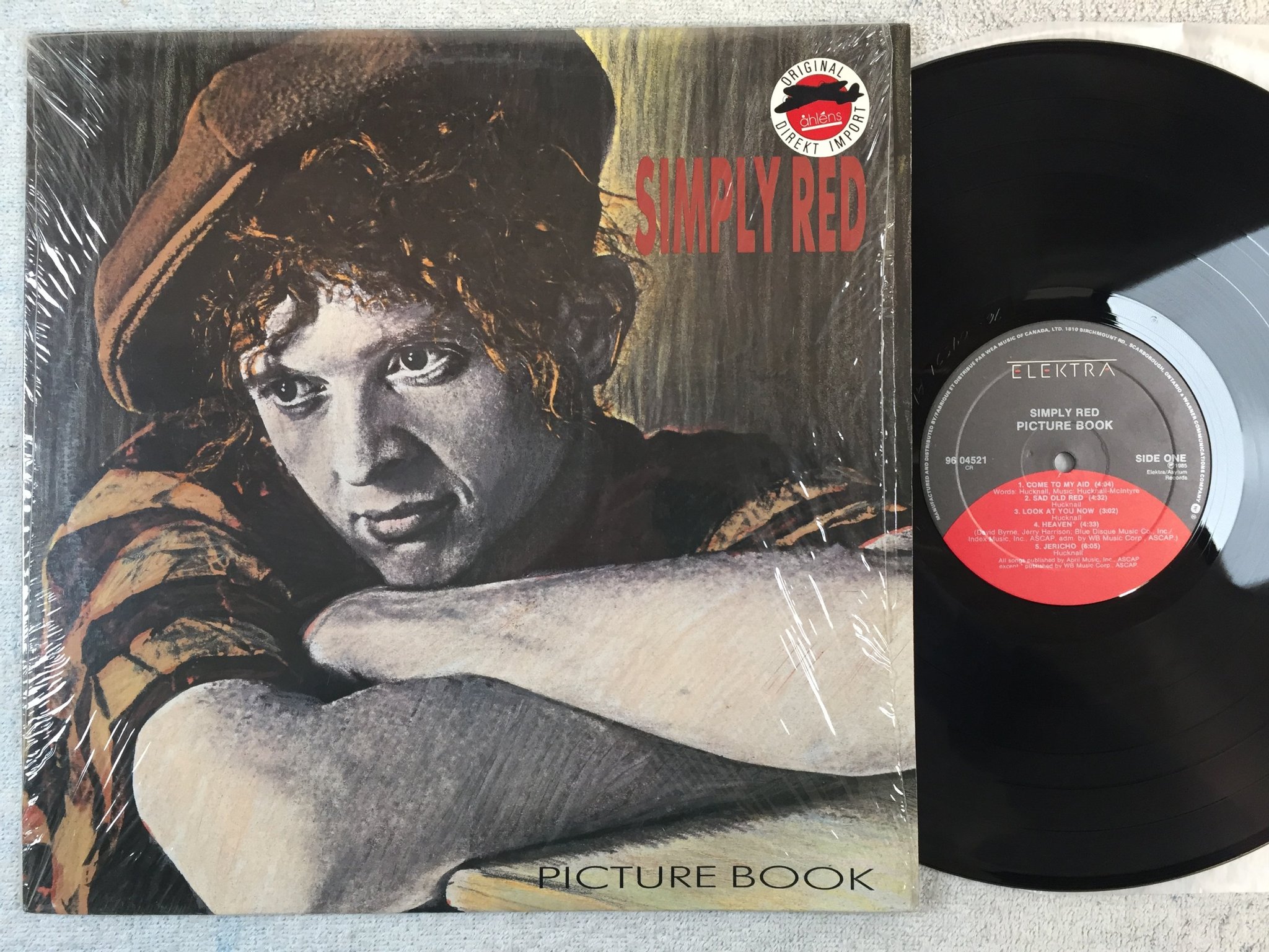 Omslagsbild för skivan SIMPLY RED picture book LP -85 Can ELEKTRA 96 04521