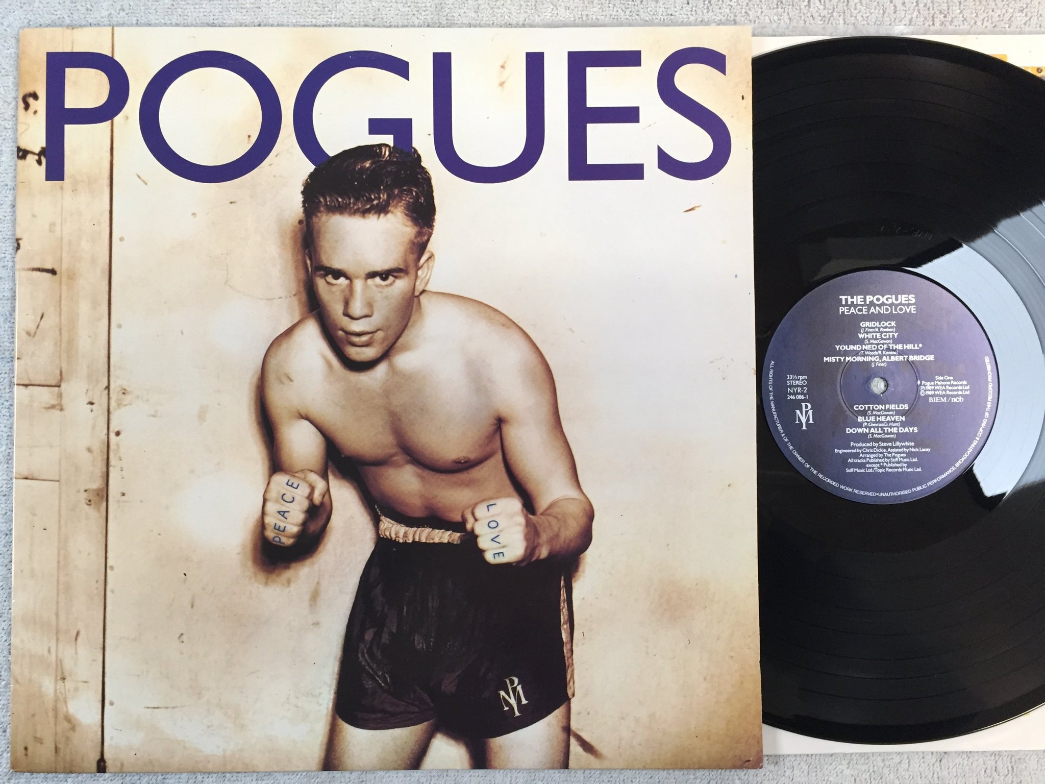 Omslagsbild för skivan THE POGUES peace and love LP -89 ncb POGUE MAHONE NYR-2