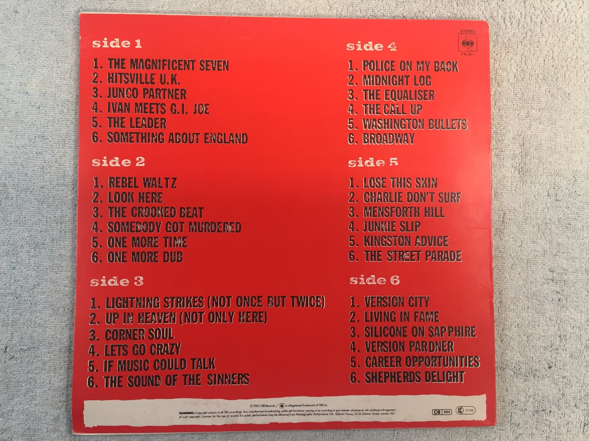 Omslagsbild för skivan THE CLASH sandinista! 3xLP -80 UK CBS FSLN 1  top copy!