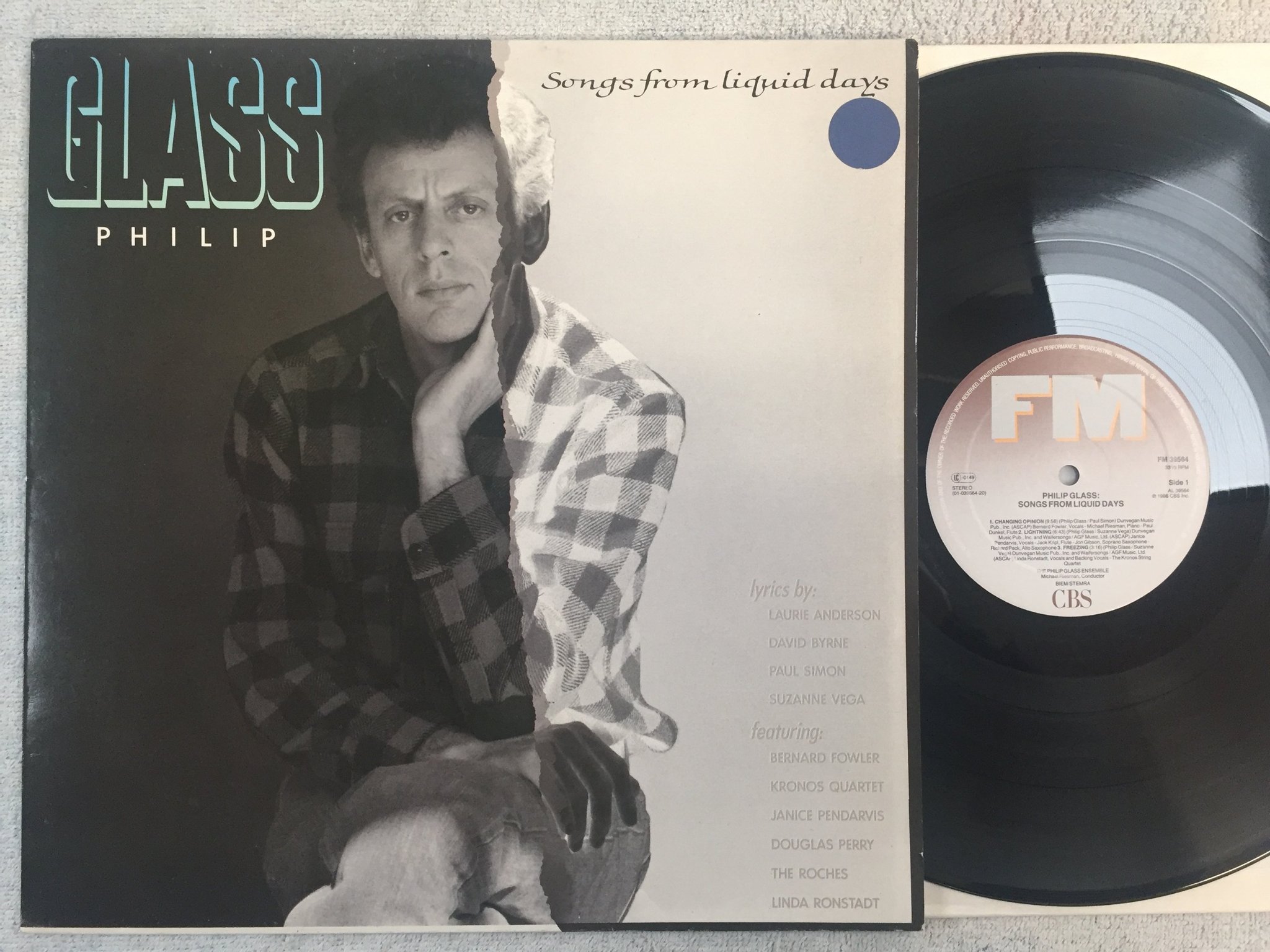 Omslagsbild för skivan PHILIP GLASS songs from liquid days LP -86 Hol FM 39564