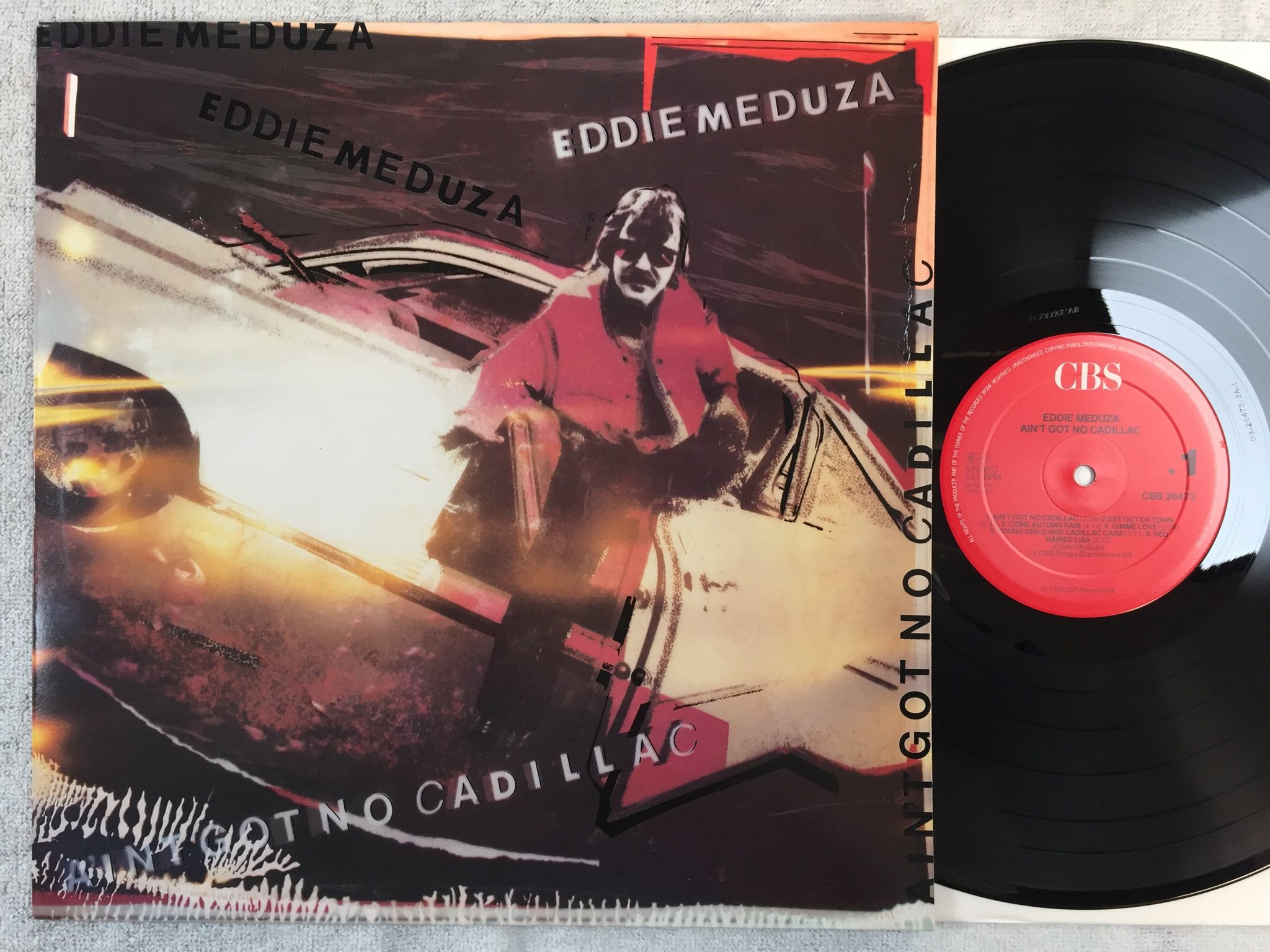 Omslagsbild för skivan EDDIE MEDUZA ain't got no cadillac LP -85 Hol CBS 26473 promo stamp on cover