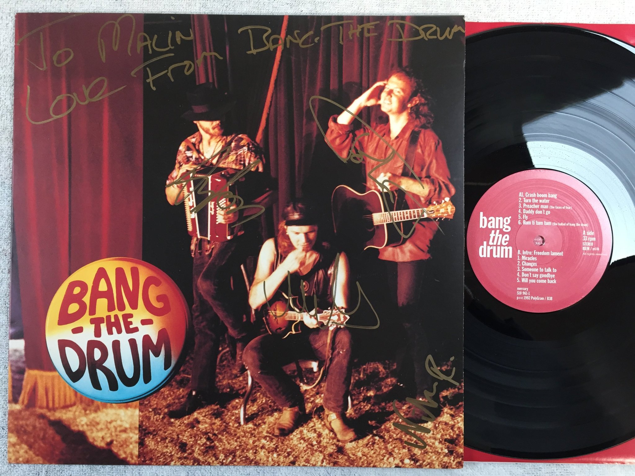Omslagsbild för skivan BANG THE DRUM s/t LP -92 ncb MERCURY 510961-1 signed by the band 