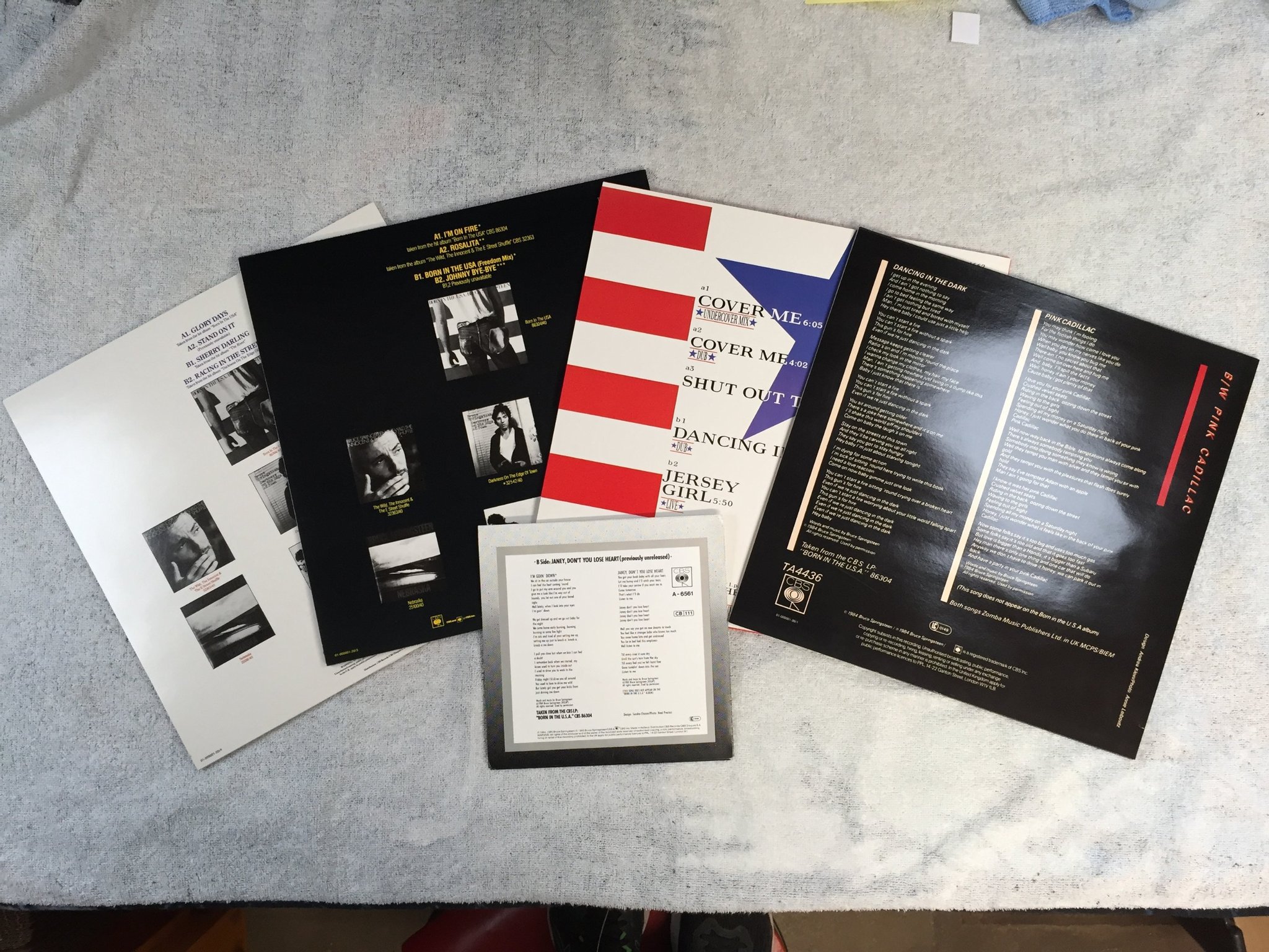 Omslagsbild för skivan BRUCE SPRINGSTEEN The Born In The U.S.A. 4x12" Single Collection + 7"single BOX