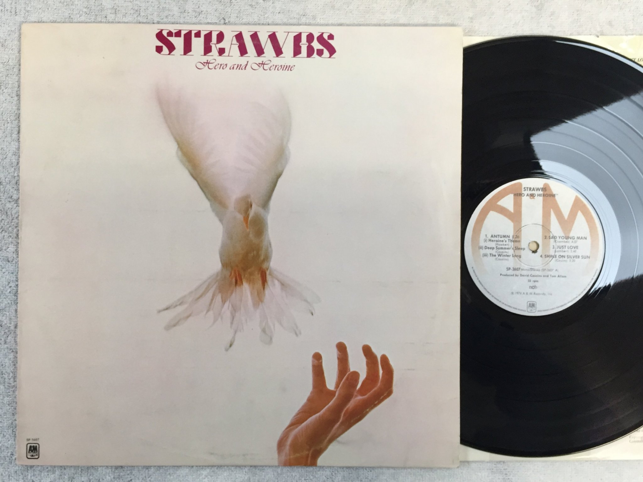 Omslagsbild för skivan STRAWBS hero & heroine LP -74 ncb A&M SP-3607