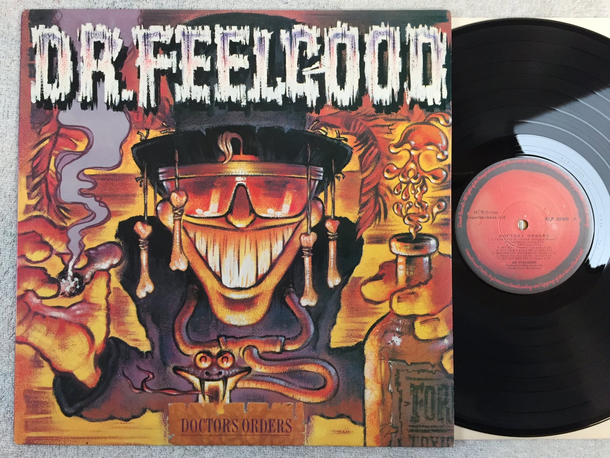 Omslagsbild för skivan DR FEELGOOD doctors orders LP -84 Norway TOMATO XLP 22005