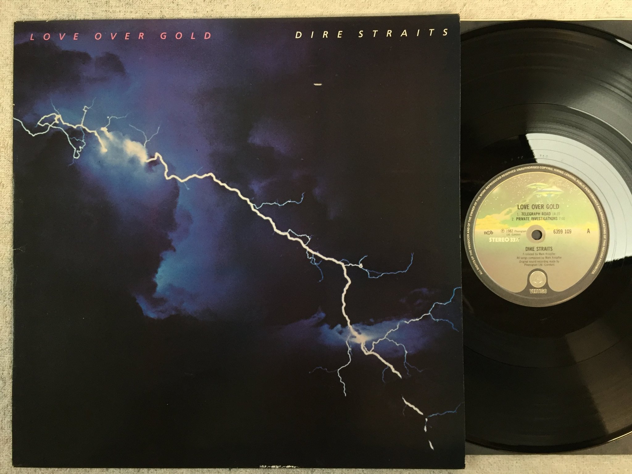 Omslagsbild för skivan DIRE STRAITS love over gold LP -82 ncb VERTIGO 6359109