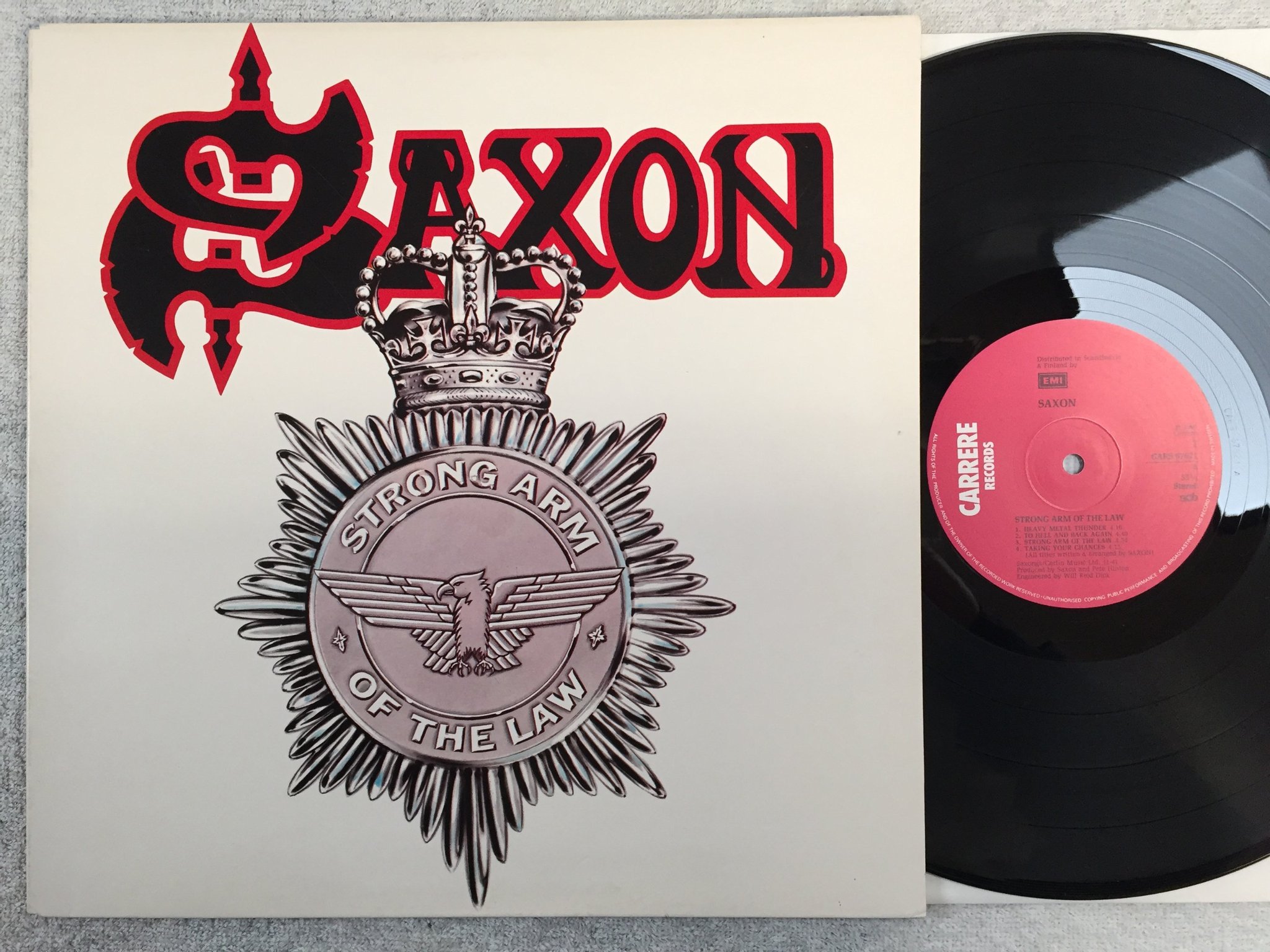 Omslagsbild för skivan SAXON strong arm of the law LP -80 ncb CARRERE CARS 67621