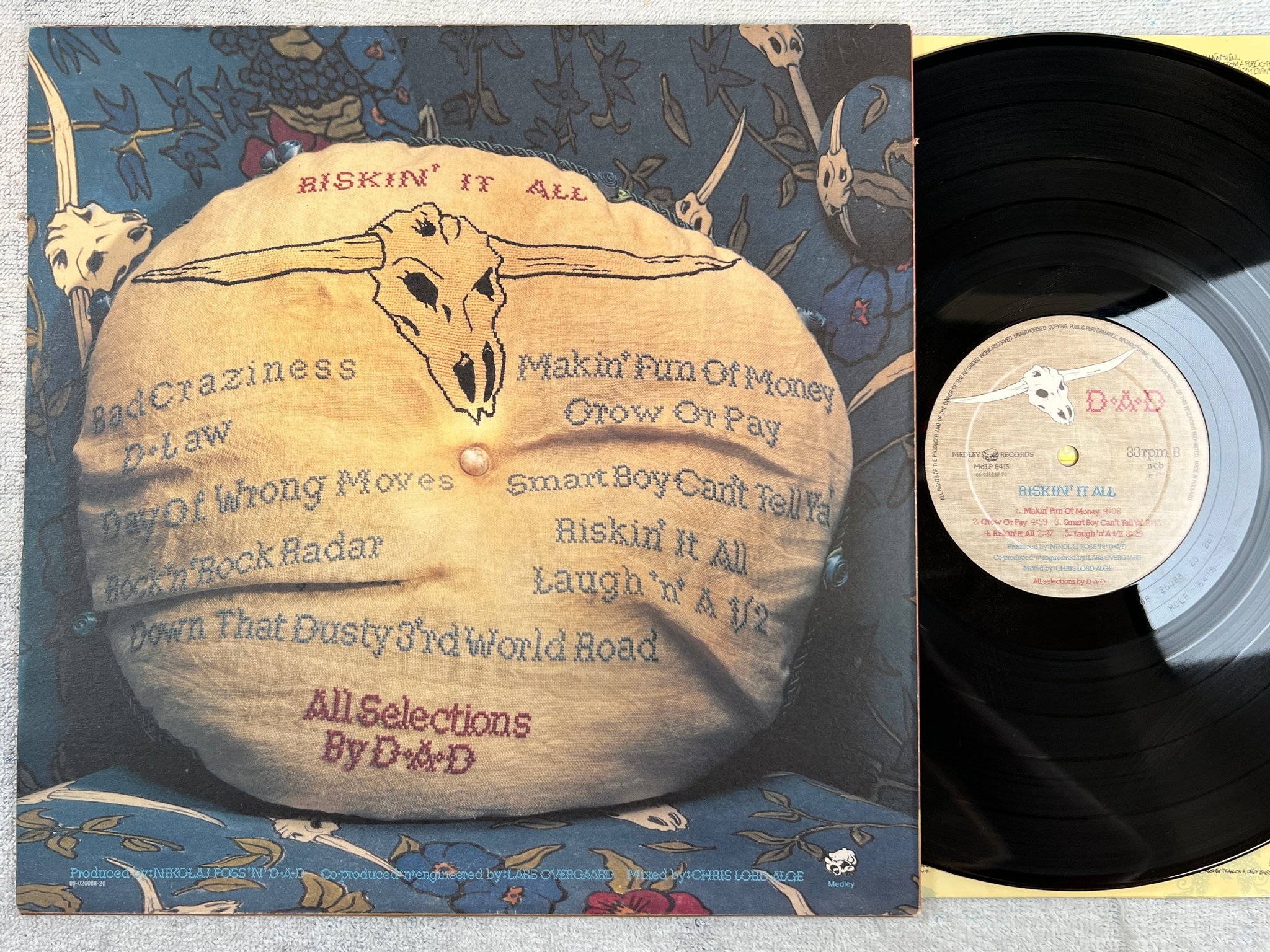 Omslagsbild för skivan D.A.D. Riskin' It All LP -91 MEDLEY MDLP 6415