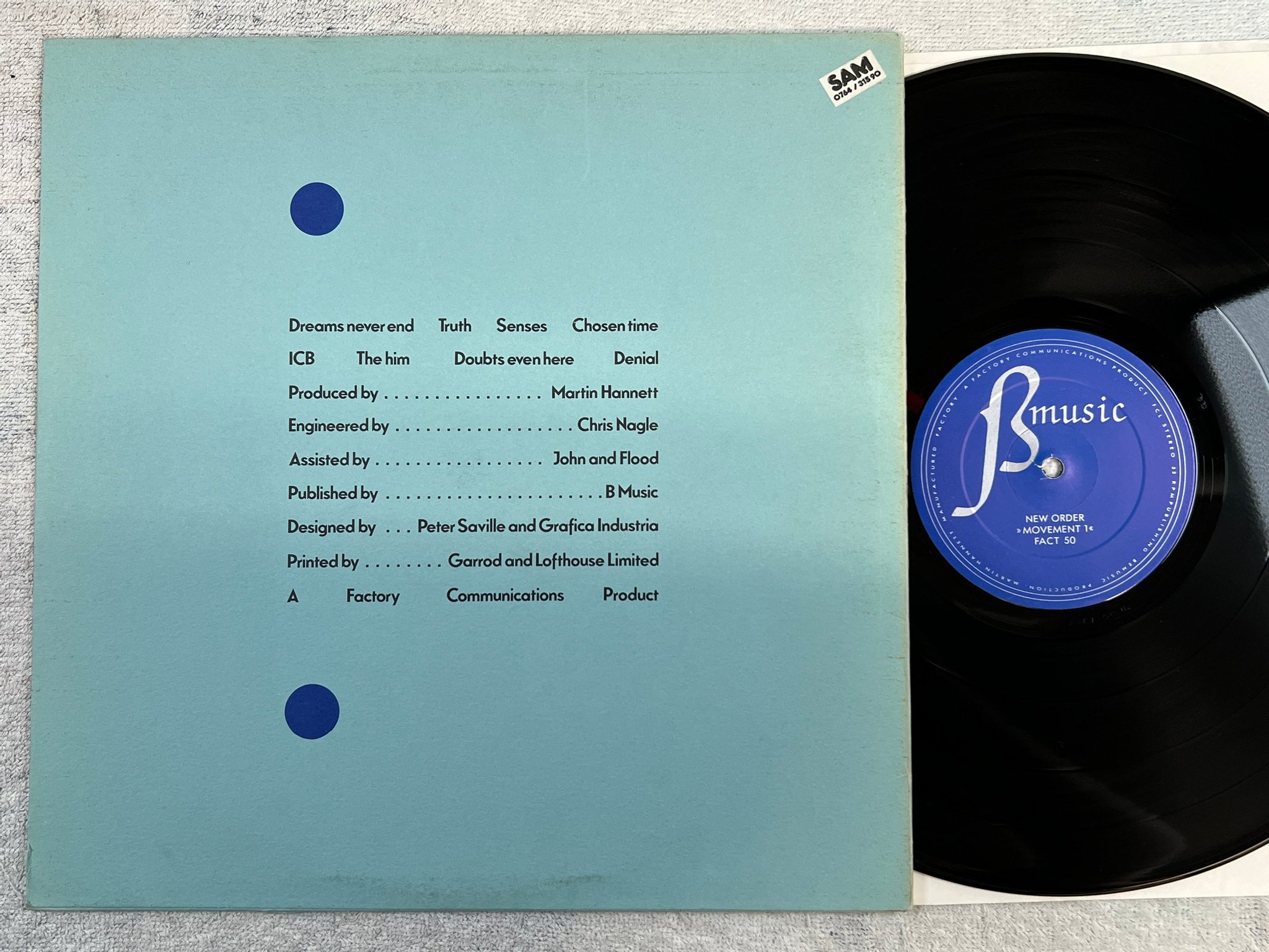 Omslagsbild för skivan NEW ORDER movement LP -81 UK FACTORY FACT 50 Original 1st press ** wow **