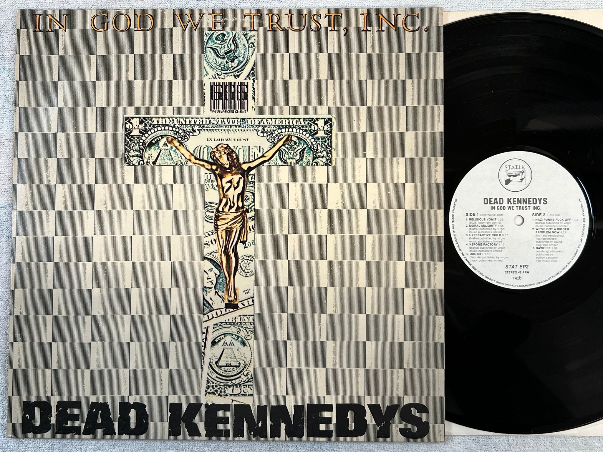 Omslagsbild för skivan DEAD KENNEDYS in God we trust inc LP NCB STATIK STAT EP2