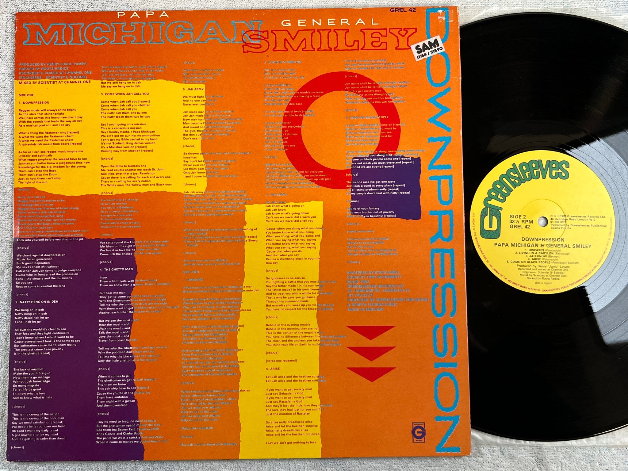Omslagsbild för skivan PAPA MICHIGAN & GENERAL SMILEY downpression LP -82 UK GREENSLEEVES GREL 42