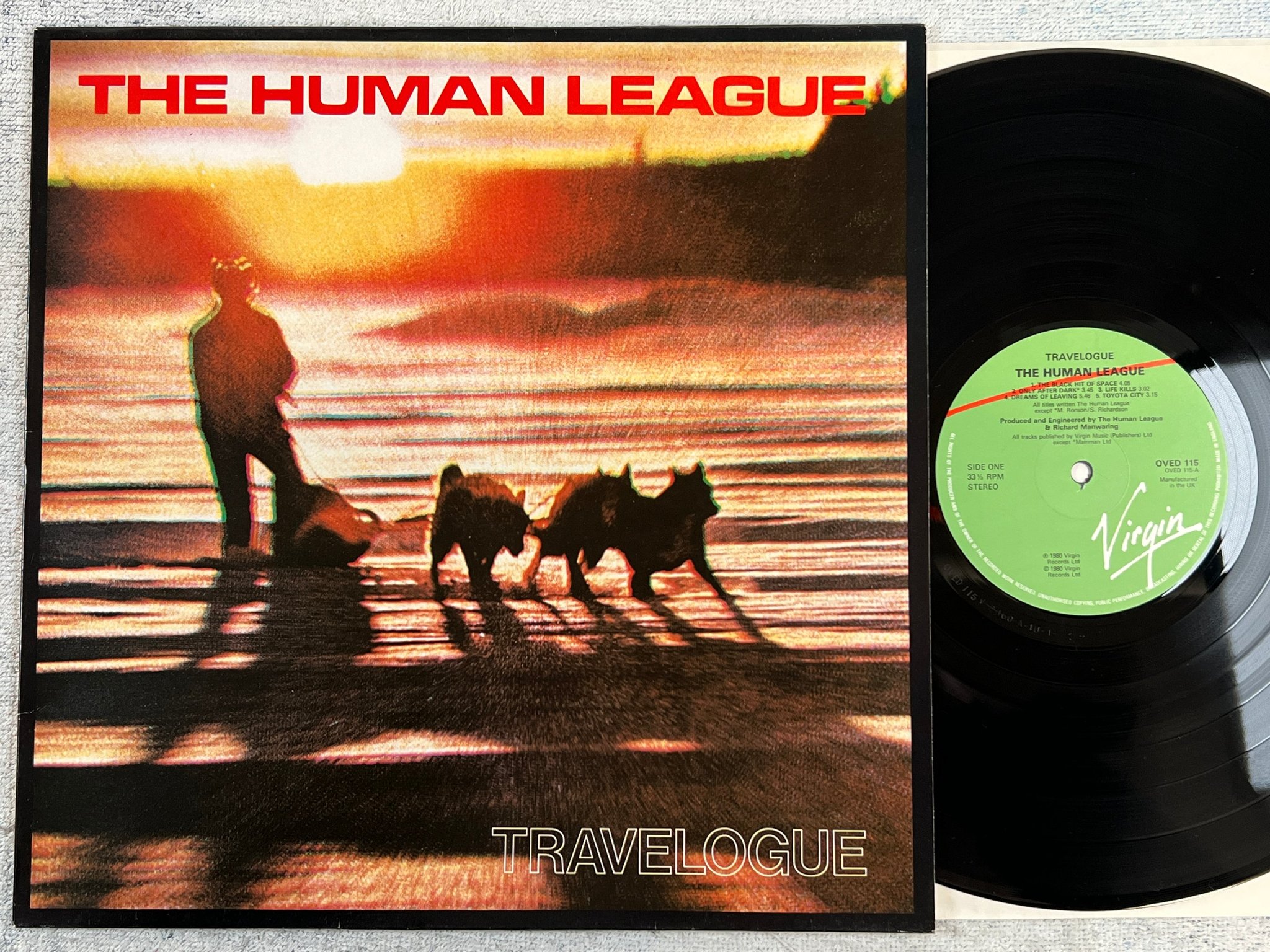 Omslagsbild för skivan THE HUMAN LEAGUE travelogue LP -80 UK VIRGIN OVED 115