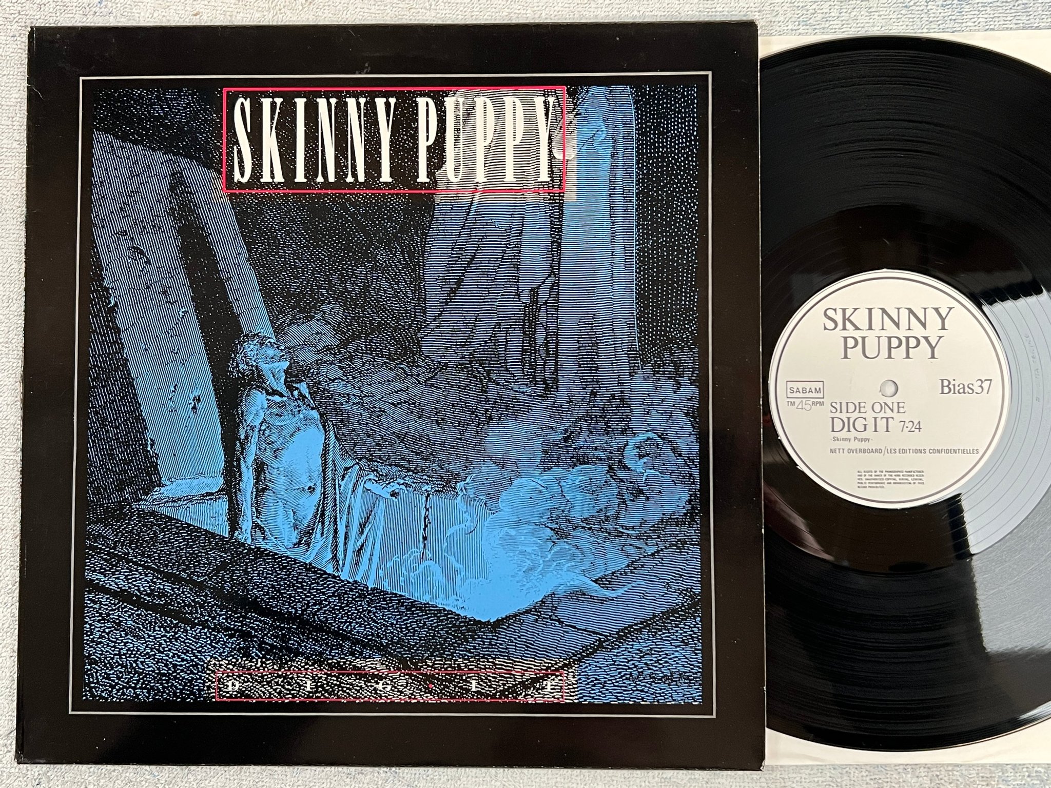 Omslagsbild för skivan SKINNY PUPPY dig it 12"single -86 Belgium PLAY IT AGAIN SAM Bias 37