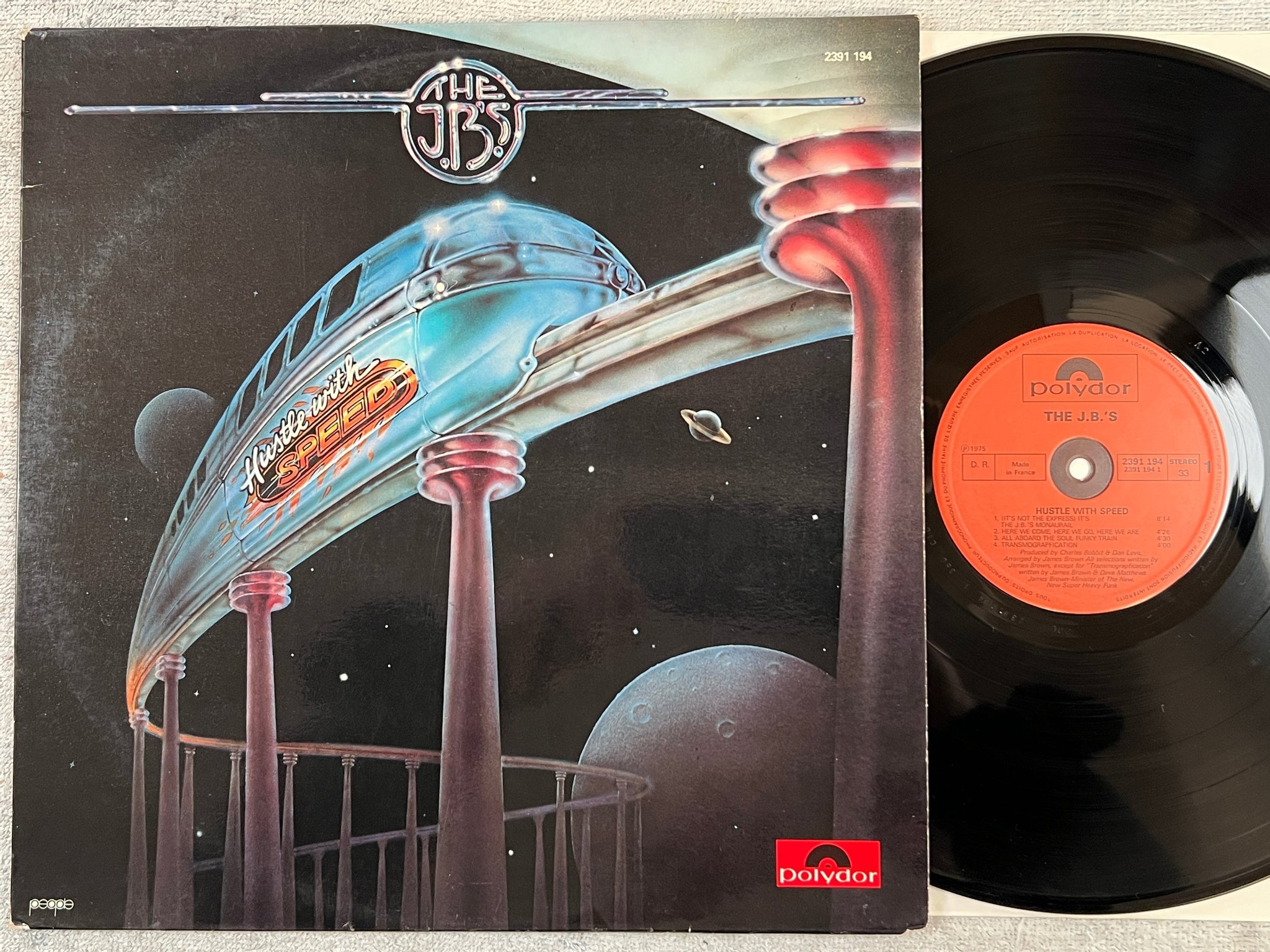Omslagsbild för skivan THE J.B.'S hustle with speed LP -75 Fra POLYDOR 2391 194 