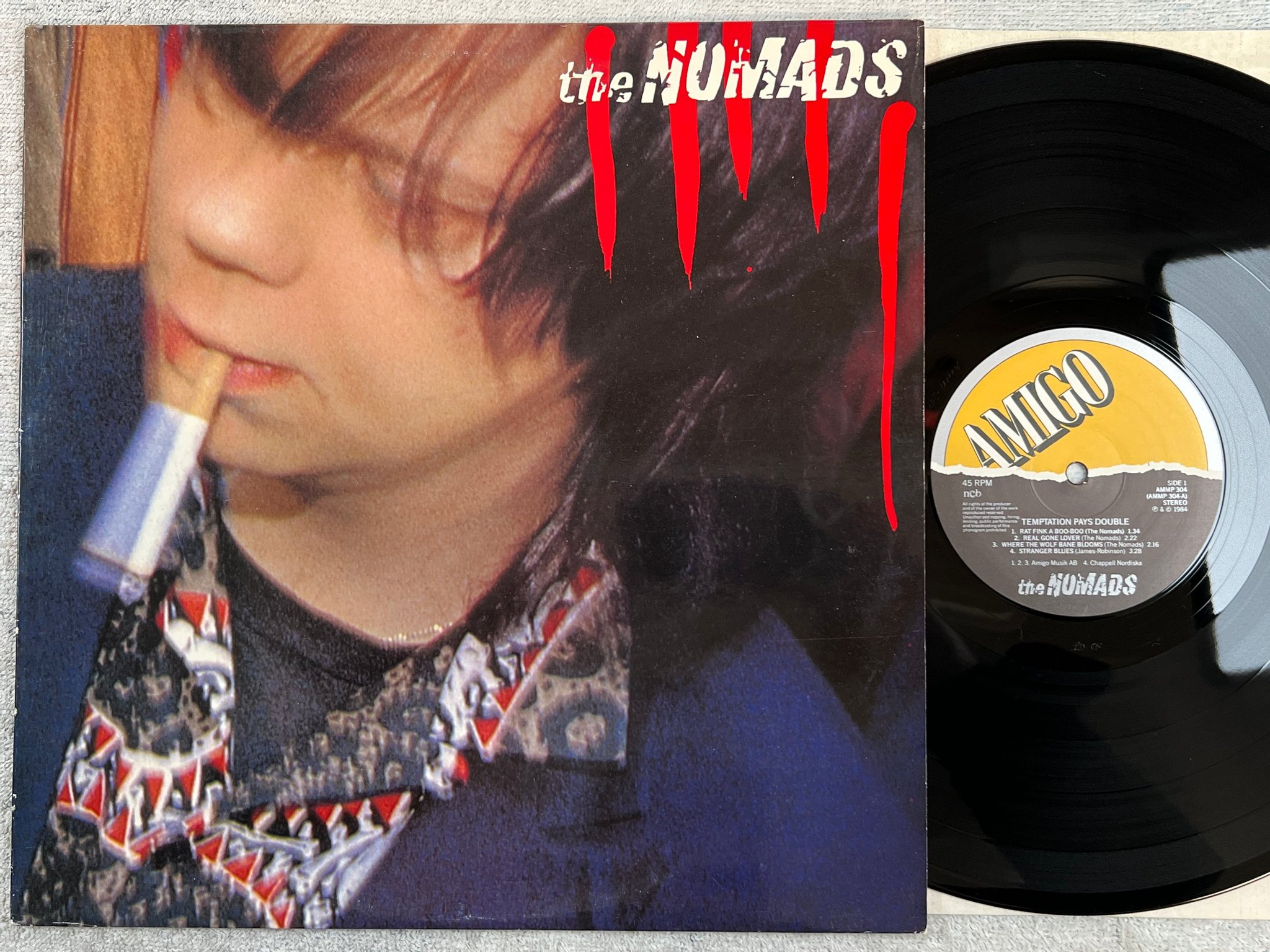 Omslagsbild för skivan THE NOMADS temptation pays double LP -84 Swe AMIGO AMMP 304
