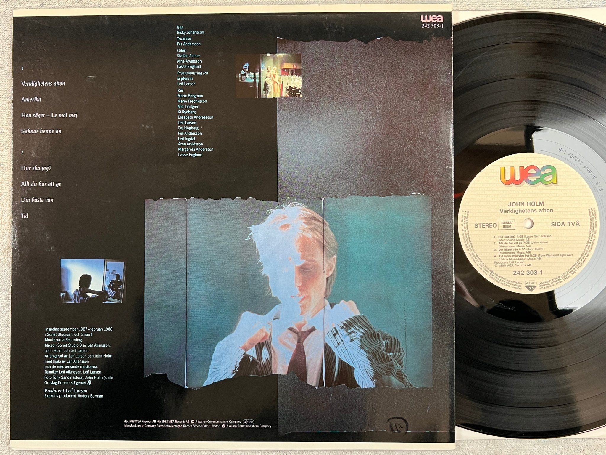 Omslagsbild för skivan JOHN HOLM verklighetens afton LP -88 Ger WEA 242303-1