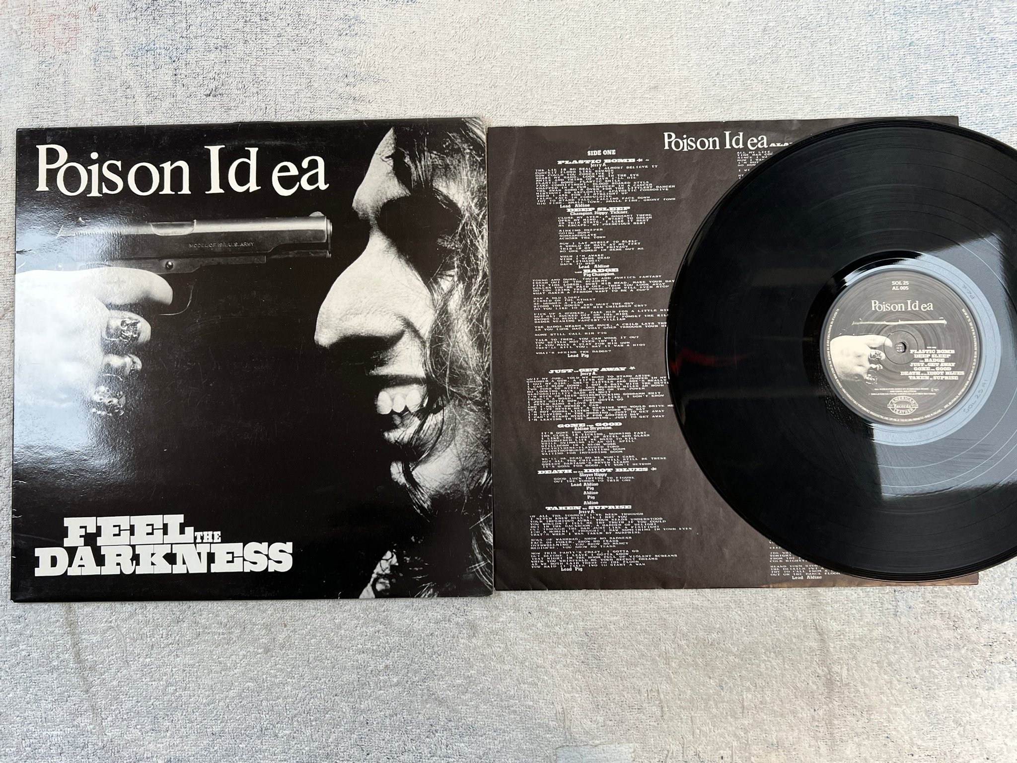 Omslagsbild för skivan POISON IDEA Feel The Darkness LP -90 UK AMERICAN LEATHER  AL 005 hardcore
