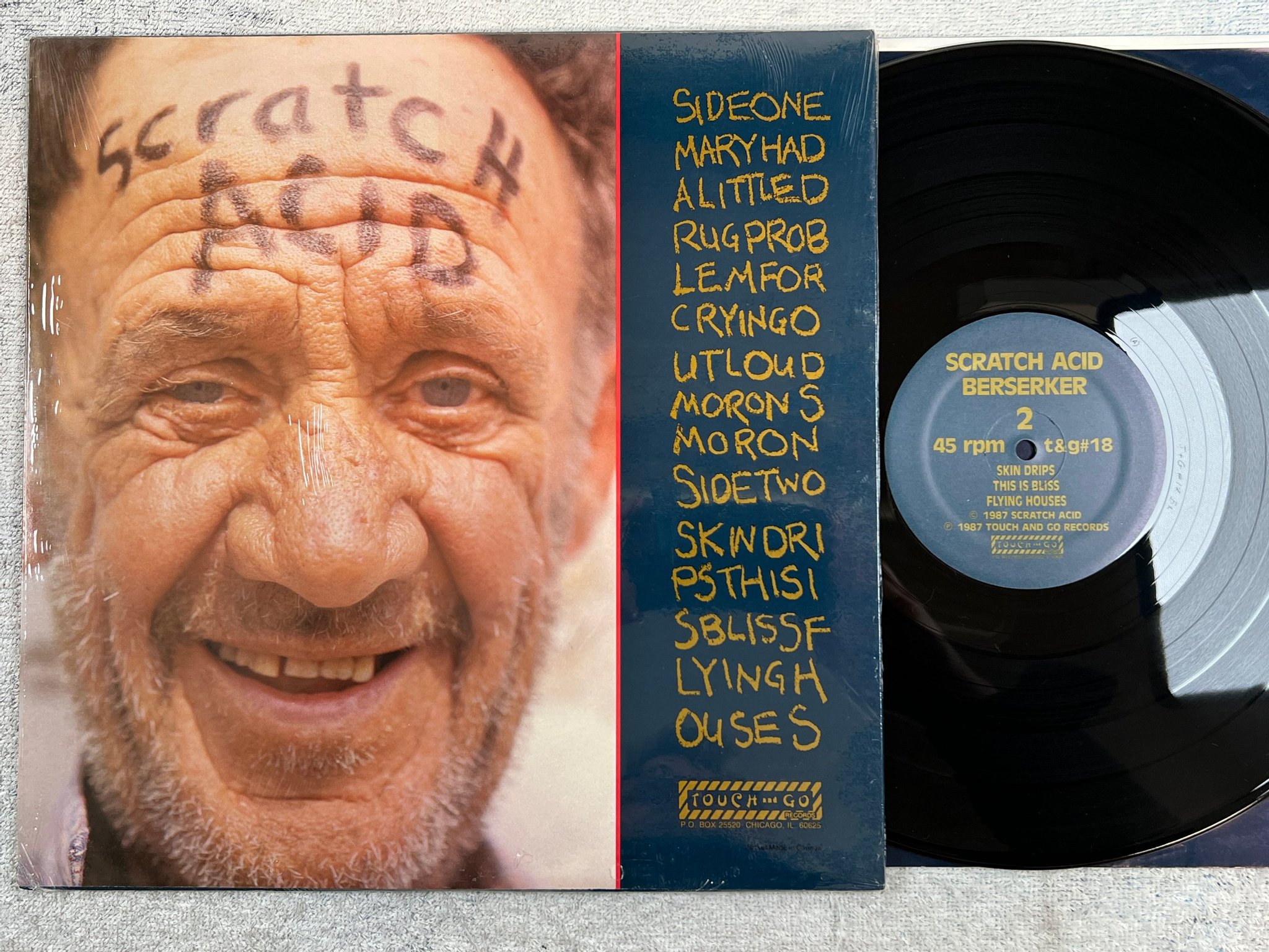 Omslagsbild för skivan SCRATCH ACID Berserker 12"EP -87 TOUCH AND GO T&G#18 post-punk