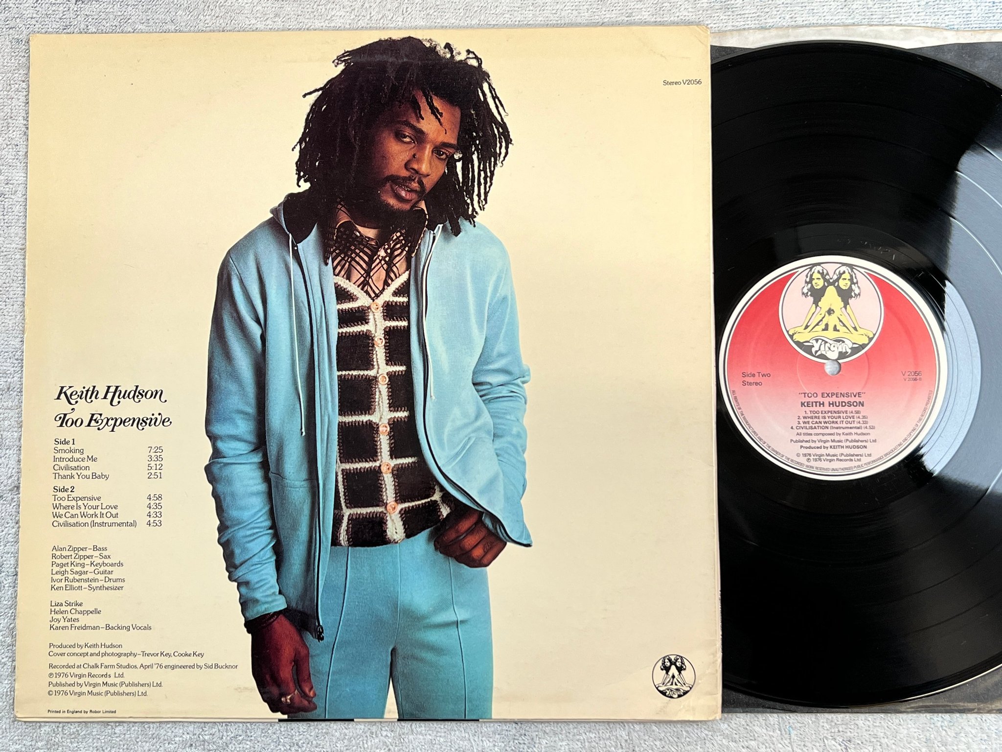 Omslagsbild för skivan KEITH HUDSON too expensive LP -76 UK VIRGIN V2056